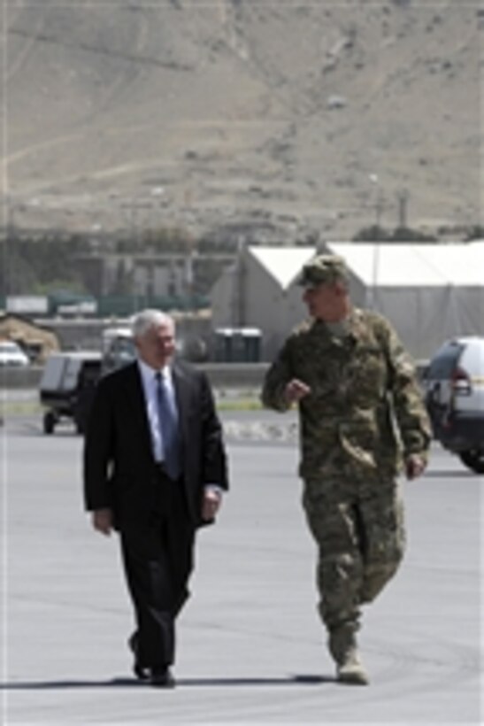 Secretary of Defense Robert M. Gates and Commander of International Security Assistance Force Joint Command Lt. Gen. David M. Rodriguez walk to the aircraft at the Kabul airport in Afghanistan on June 7, 2011.  