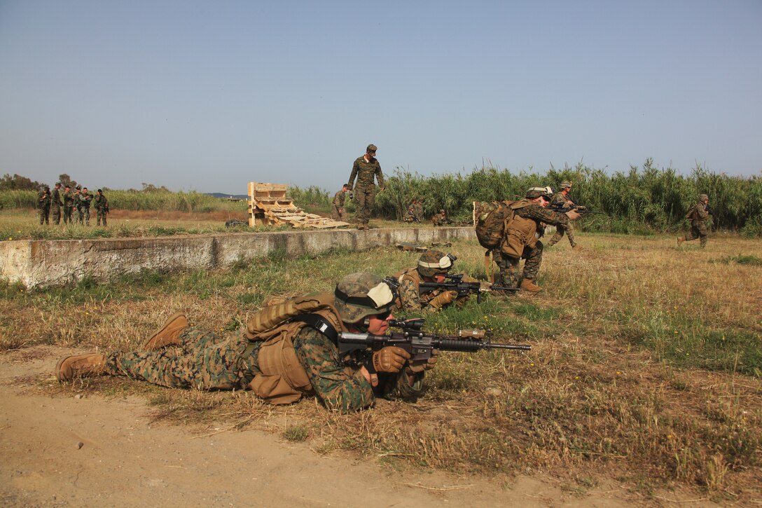 Marines with Golf Company, Battalion Landing Team, 2nd Battalion, 2nd Marine Regiment, 22nd Marine Expeditionary Unit, conduct a buddy rush drill demonstration for Greek soldiers during the Greek Bi-lateral exercise in Maleme, Crete, June 7, 2011.  Elements of Combat Logistics Battalion 22, the BLT and force reconnaissance platoon participated in the training with the Greek military in Crete.  The Marines and sailors of the 22nd MEU are currently deployed with Amphibious Squadron 6 aboard the USS Bataan Amphibious Ready Group serving as a potent, formidable and deterrent force who continues to train and improve their capability to operate as a cohesive and effective Marine Air Ground Task Force.  The 22nd MEU is a multi-mission, capable force comprised of an Aviation Combat Element, Marine Medium Tilt Rotor Squadron 263 (Reinforced); a Logistics Combat Element, CLB 22; a Ground Combat Element, BLT, 2nd Bat. 2nd Mar., Reg.; and its Command Element.