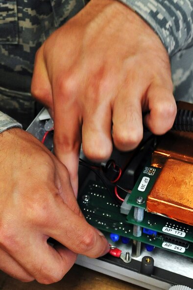 KUNSAN AIR BASE, Republic of Korea -- Senior Airman Luke Laris, 8th Medical Support Squadron biomedical equipment repair technician, reassembles a surgical suction unit here June 8. Airman Laris was stationed at Travis Air Force Base, Calif., before arriving here and is a native of Syracuse, N.Y. (U.S. Air Force photo/Senior Airman Brittany Y. Bateman)