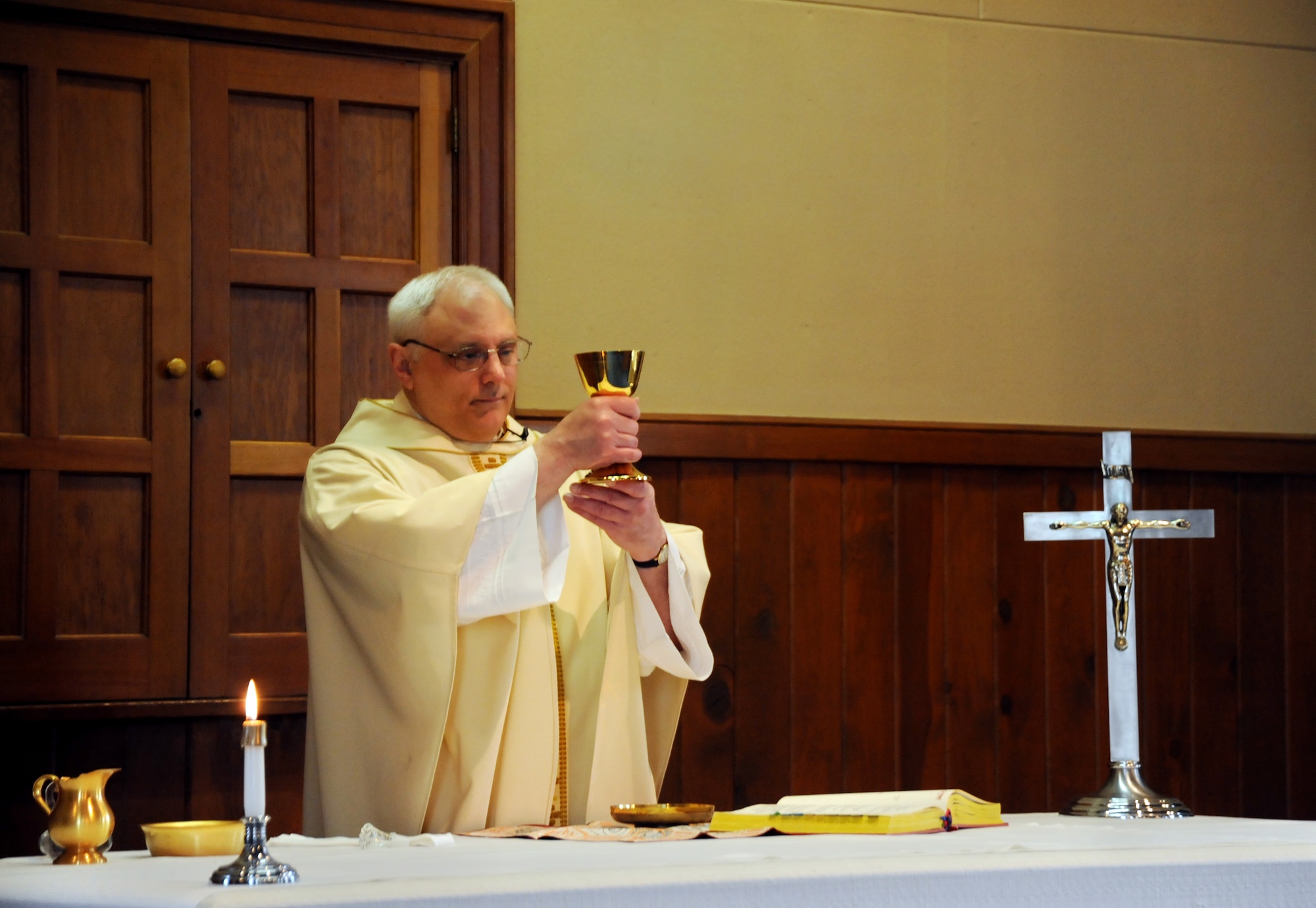 U.S. Air Force Lt. Col. Rick Sirianni prepares the Blessed Sacrament during his final mass on May 15, 2011 at the Portland Air National Guard Base Chapel, Portland, Ore. Father Sirianni is retiring from the Oregon Air National Guard after 23 years of service. (U.S. Air Force Photograph by Tech. Sgt. John Hughel) (Released)