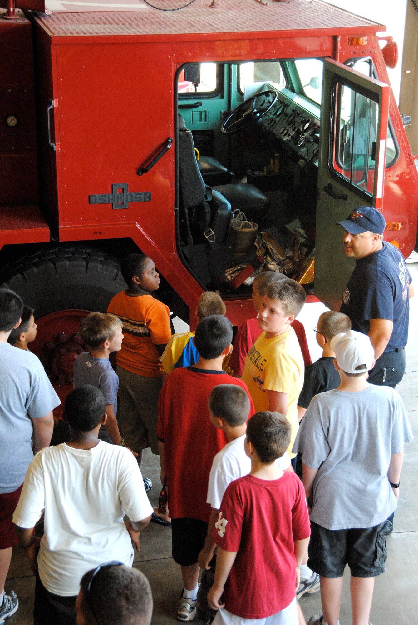 Members of the fire department at Vance AFB, Okla., gave the Camp Tomahawk boys a complete tour of the fire station, to include a hands-on experience with firefighting equipment and an aircraft emergency response and rescue vehicle. This is the 37th year for Camp Tomahawk. (U.S. Air Force photo/ Zach Sproul)
