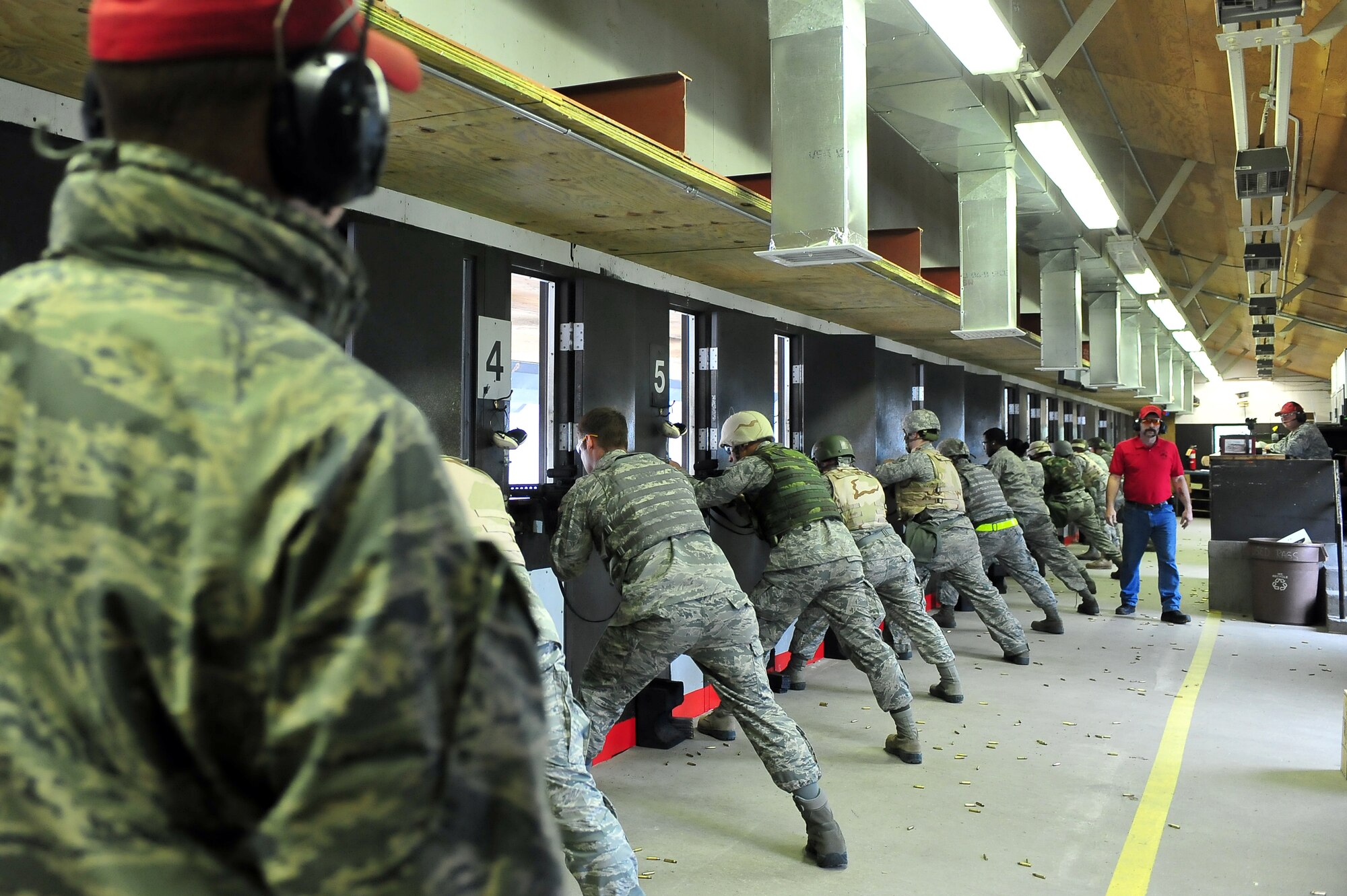 MINOT AIR FORCE BASE, N.D. – Airmen fire M-16A2s during the Air Force Qualification Course at the Combat Arms Training and Maintenance firing range here June 7. Airmen tasked to deploy, train to ensure proficiency with combat firearms. (U.S. Air Force Photo/Senior Airman Jesse Lopez)

