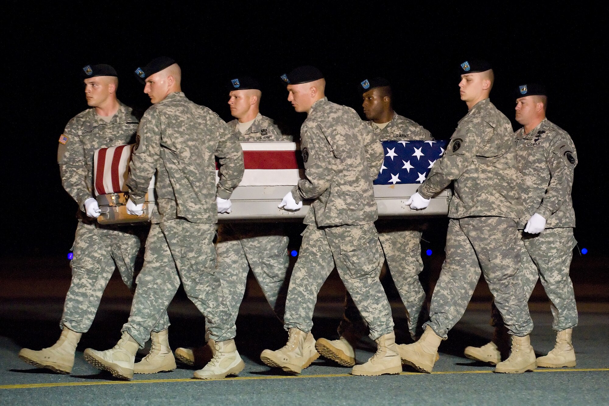 A U.S. Army carry team transfers the remains of Army Pfc. Michael B. Cook, of Middletown, Ohio, at Dover Air Force Base, Del., June 8, 2011. He was assigned to the1st Battalion, 7th Field Artillery Regiment, 2nd Heavy Brigade Combat Team, 1st Infantry Division, Fort Riley, Kan. (U.S. Air Force photo/Roland Balik)

