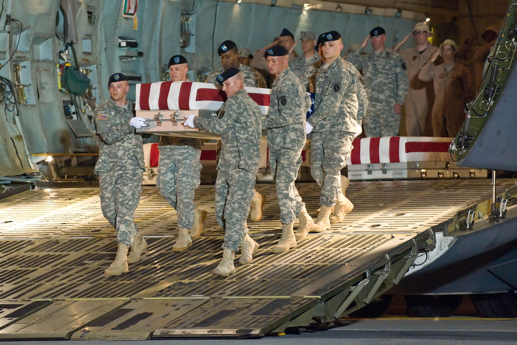 A U.S. Army carry team transfers the remains of Army Spc. Emilio J. Campo Jr., of Madelia, Minn., at Dover Air Force Base, Del., June 8, 2011. He was assigned to the1st Battalion, 7th Field Artillery Regiment, 2nd Heavy Brigade Combat Team, 1st Infantry Division, Fort Riley, Kan. (U.S. Air Force photo/Roland Balik)
