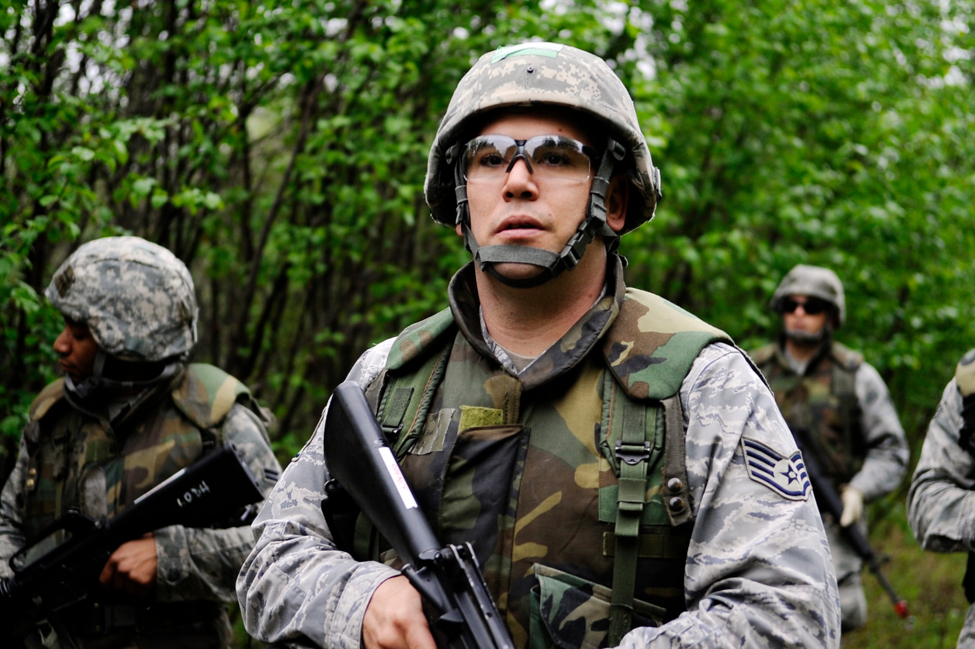 Staff Sgt. Esequiel King leads the way during a dismounted patrol preparedness exercise  for civil engineer Airmen June 2, 2011, Eielson Air Force Base, Alaska. The 354th Civil Engineer Squadron Explosive Ordnance Disposal flight familiarizes deploying Airmen with the fundamentals of tactical troop movement and improvised explosive devices. Sergeant King is assigned to the 354th CES. (U.S. Air Force photo/Airman 1st Class Laura Goodgame) 