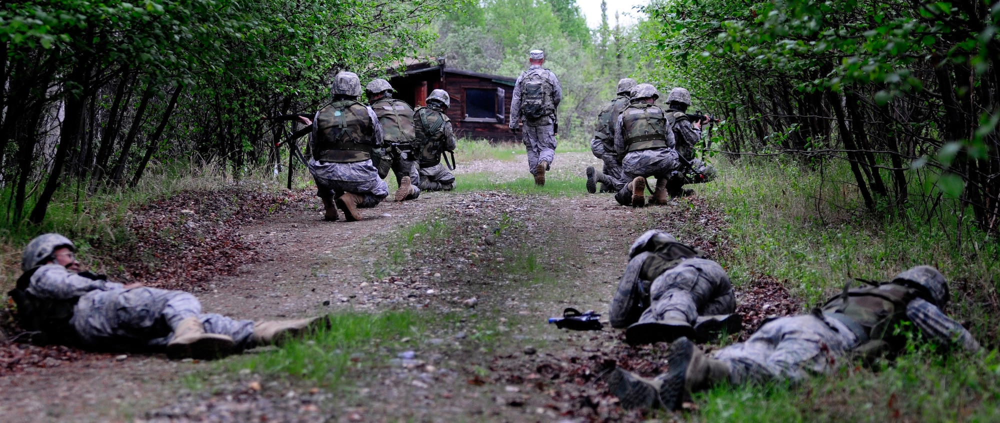 Airmen take fire during a dismounted patrol preparedness exercise  for civil engineer Airmen June 2, 2011, Eielson Air Force Base, Alaska. The 354th Civil Engineer Squadron Explosive Ordnance Disposal flight familiarizes deploying Airmen with the fundamentals of tactical troop movement and improvised explosive devices. The Airmen are assigned to the 354th CES. (U.S. Air Force photo/Airman 1st Class Laura Goodgame) 