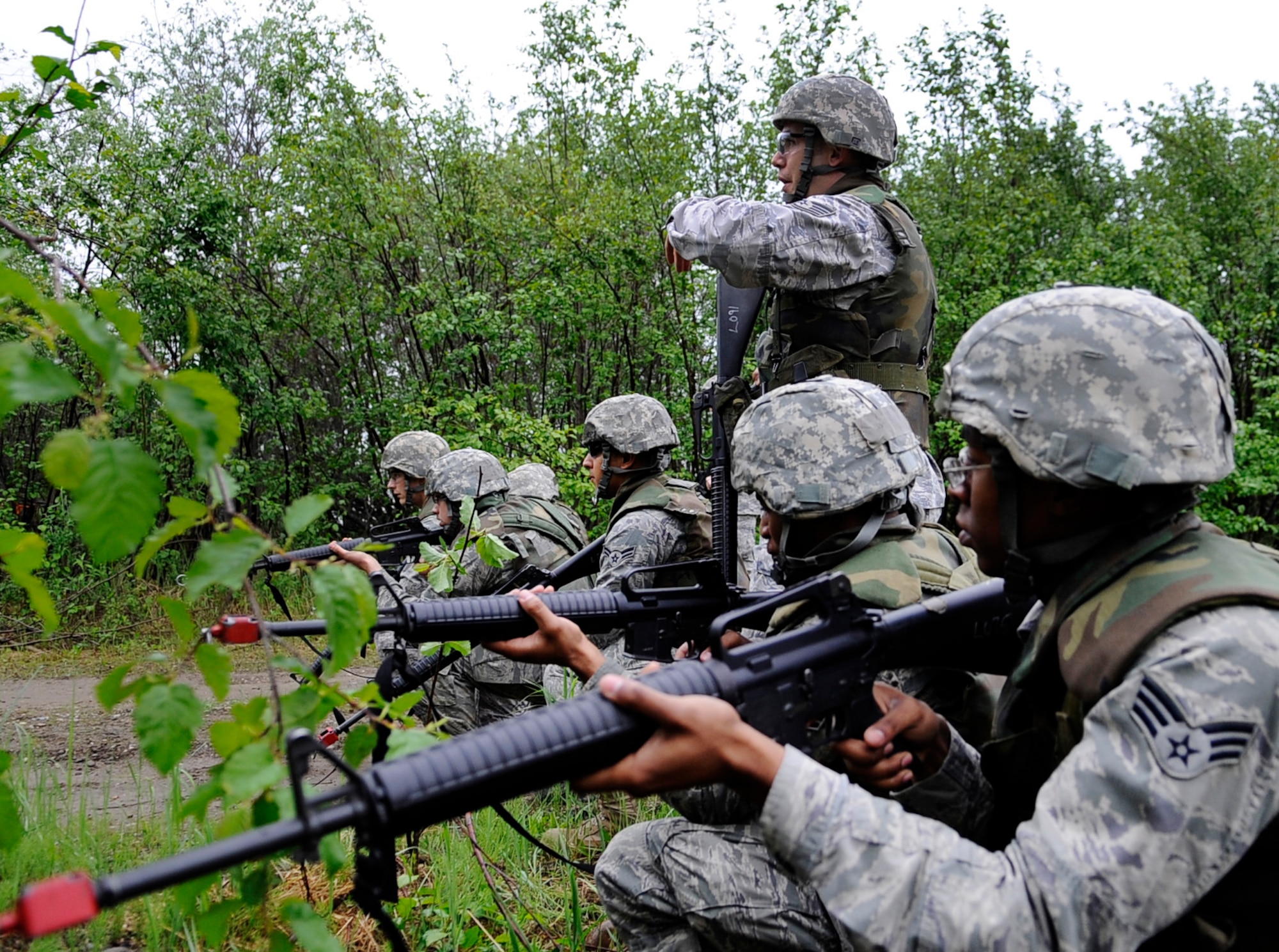 Staff Sgt. Esequiel King gives instructions during a dismounted patrol preparedness exercise  for civil engineer Airmen June 2, 2011, Eielson Air Force Base, Alaska. The 354th Civil Engineer Squadron Explosive Ordnance Disposal flight familiarizes deploying Airmen with the fundamentals of tactical troop movement and improvised explosive devices. Sergeant King is assigned to the 354th CES. (U.S. Air Force photo/Airman 1st Class Laura Goodgame) 