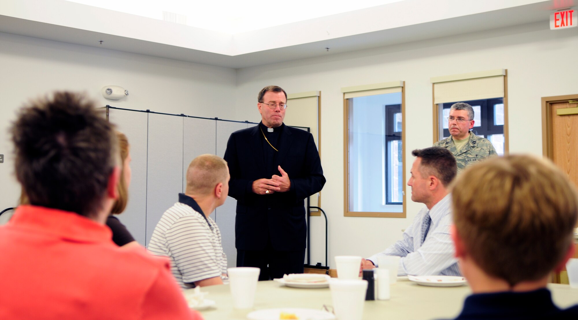Bishop Neal Buckon addresses guests at the Chapel Fellowship Hall June 3, 2011, Eielson Air Force Base, Alaska.  The bishop familiarized himself with guests, helping to solidify the membership of the different faiths worshiped and the base community at large. Bishop Buckon is the Auxiliary Bishop for Archdiocese for the Military Services, USA.  (U.S. Air Force photo/Airman 1st Class Yash Rojas)