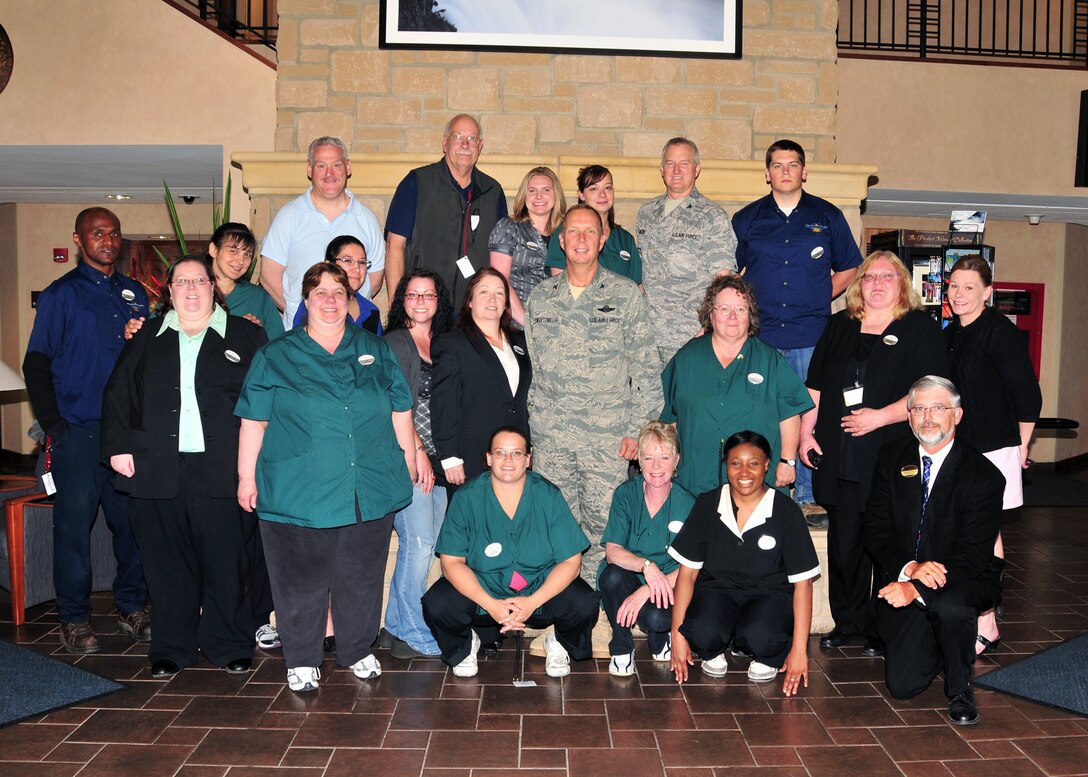 The lodging and Services Management Team poses with 914th Airlift Wing Commander Col. Allan L. Swartzmiller in the lobby of building 300, June 2, 2011, Niagara Falls Air Reserve Station, NY. The team was assembled in recognition of their winning the Air Force Innkeeper award with a grade of 94.5%. (U.S. Air Force photo by Staff Sgt. Joseph McKee)