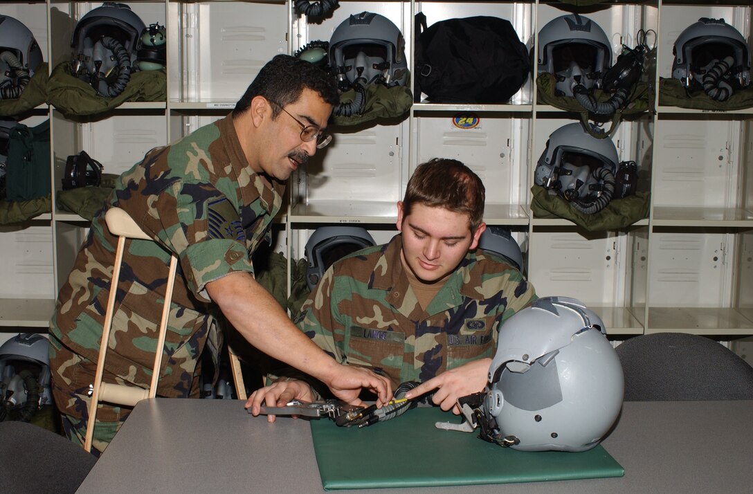 Master Sgt. Bob Barajas (left), trains Senior Airman Zachery Lange on the intricasies of aircrew lifesupport equipment.
Master Sgt. Barajas was an Aircrew Lifesupport Craftsman assigned to the 108th Air Refueling Squadron, part of the 126th Air Refueling Wing, located at Scott
AFB, IL.
Master Sgt. Barajas passed away on Jan. 10, 2011 after a brief battle with cancer.
During his tenure with the 126th,
Master Sgt. Barajas served as an integral member of the Wing and embodied the Air Force Core Values; especially, ‘Service Before Self.’
Master Sgt. Barajas served his country for more than 34 years.