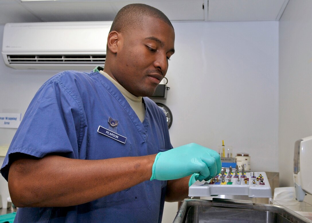Staff Sgt. Chris Pearson, 579th Dental Squadron dental technician, carefully cleans rotary instruments at the Bolling clinic Tuesday, June 7. The 579th Medical Group delivers medical and dental care to more than 20,000 tri-Service beneficiaries assigned to the National Capital Region. It also directs an Advanced Education General Dentistry residency program and plans, trains and deploys Airmen to support worldwide contingences. (U.S. Air Force photo/Senior Airman Laura Turner)