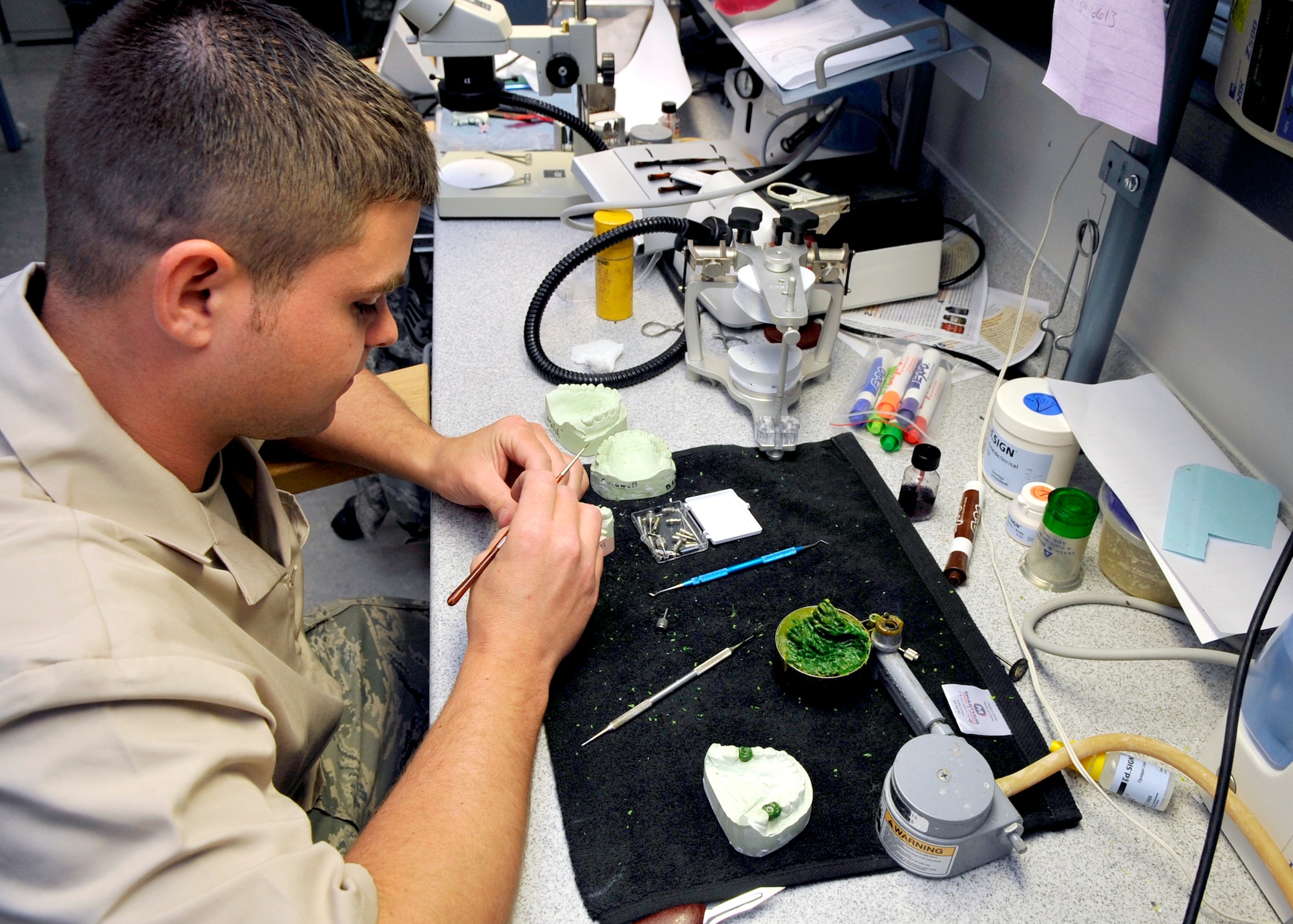 Staff Sgt. Justin Bricklen, 579th Dental Squadron dental technician, builds a crown for a patient at the Bolling clinic Tuesday, June 7. The 579th Medical Group delivers medical and dental care to more than 20,000 tri-Service beneficiaries assigned to the National Capital Region. It also directs an Advanced Education General Dentistry residency program and plans, trains and deploys Airmen to support worldwide contingences. (U.S. Air Force photo/Senior Airman Laura Turner)