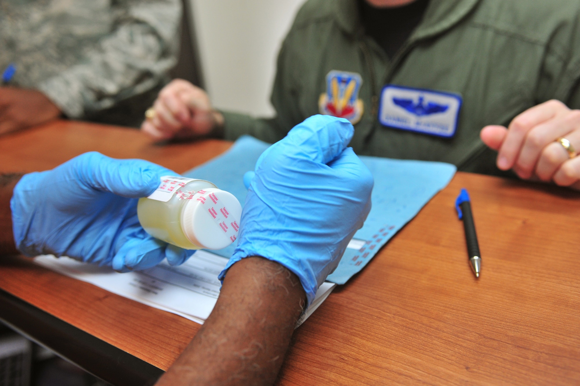 Maj. Daniel McAffee, 20th Operations Support Squadron current operations flight commander, recieves instructions  after a random drug test here June 8, 2011. The demand reduction drug facility is located next to the medical clinic here and test about 50 to 100 people a day. ( U.S. Air Force photo by Airman 1st Class Ashley Gardner/ Released)