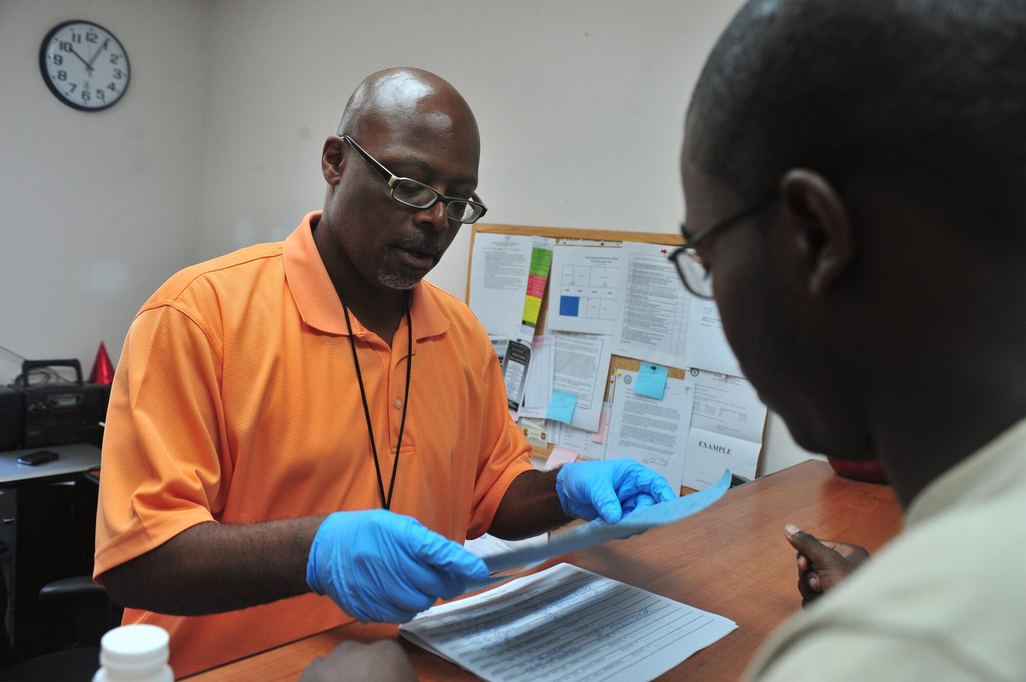 Airman 1st Class Jamari Smith, 20th Componet Maintenance Squadron electronic welfare, goes through his paper work after a random drug test here June 8, 2011. The demand reduction drug facility is located next to the medical clinic here and test about 50 to 100 people a day.( U.S. Air Force photo by Airman 1st Class Ashley Gardner/ Released)