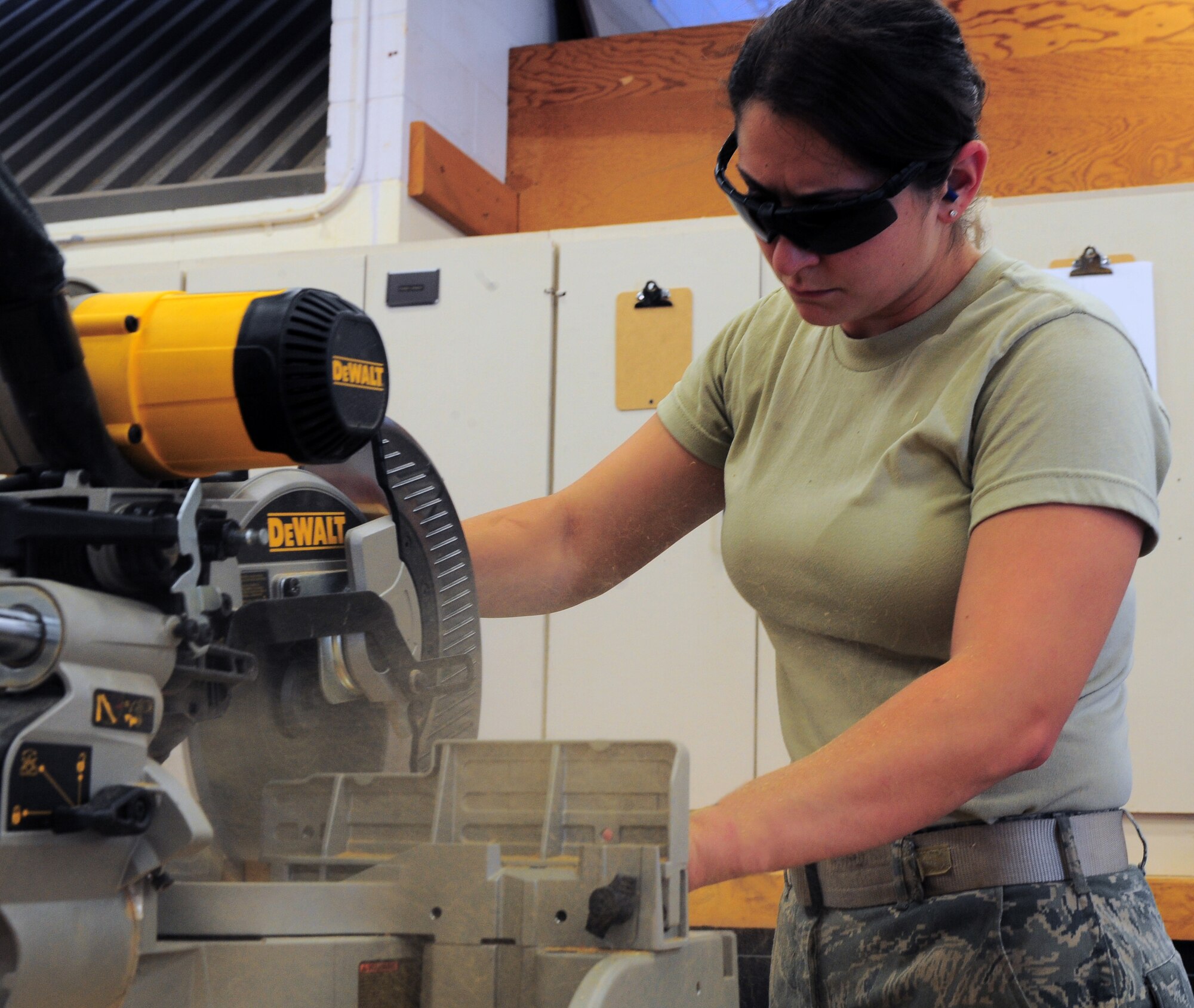 SHAW AIR FORCE BASE, S.C. -- Senior Airman Camille Regina, 20th Civil Engineer Squadron structural maintenance, cuts a piece of wood June 1, 2011. Airman Regina is the Warrior of the Week for May 30 through June 3, 2011. She was recently nominated for Operations Flight Craftsmen of the Month.(U.S. Air Force photo/Airman 1st Class Daniel Phelps)