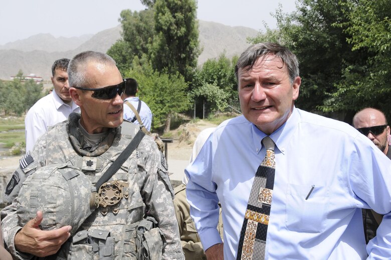 Air Force Lt. Col. Neil Stockfleth, officer-in-charge of the agriculture section for the Iowa National Guard's 734th Agribusiness Development Team, briefs U.S. Ambassador to Afghanistan Karl Eikenberry on agriculture issues during a visit to Kunar Province on June 1, 2011. (U.S. Air Force photo by Capt. Peter Shinn) (Released)