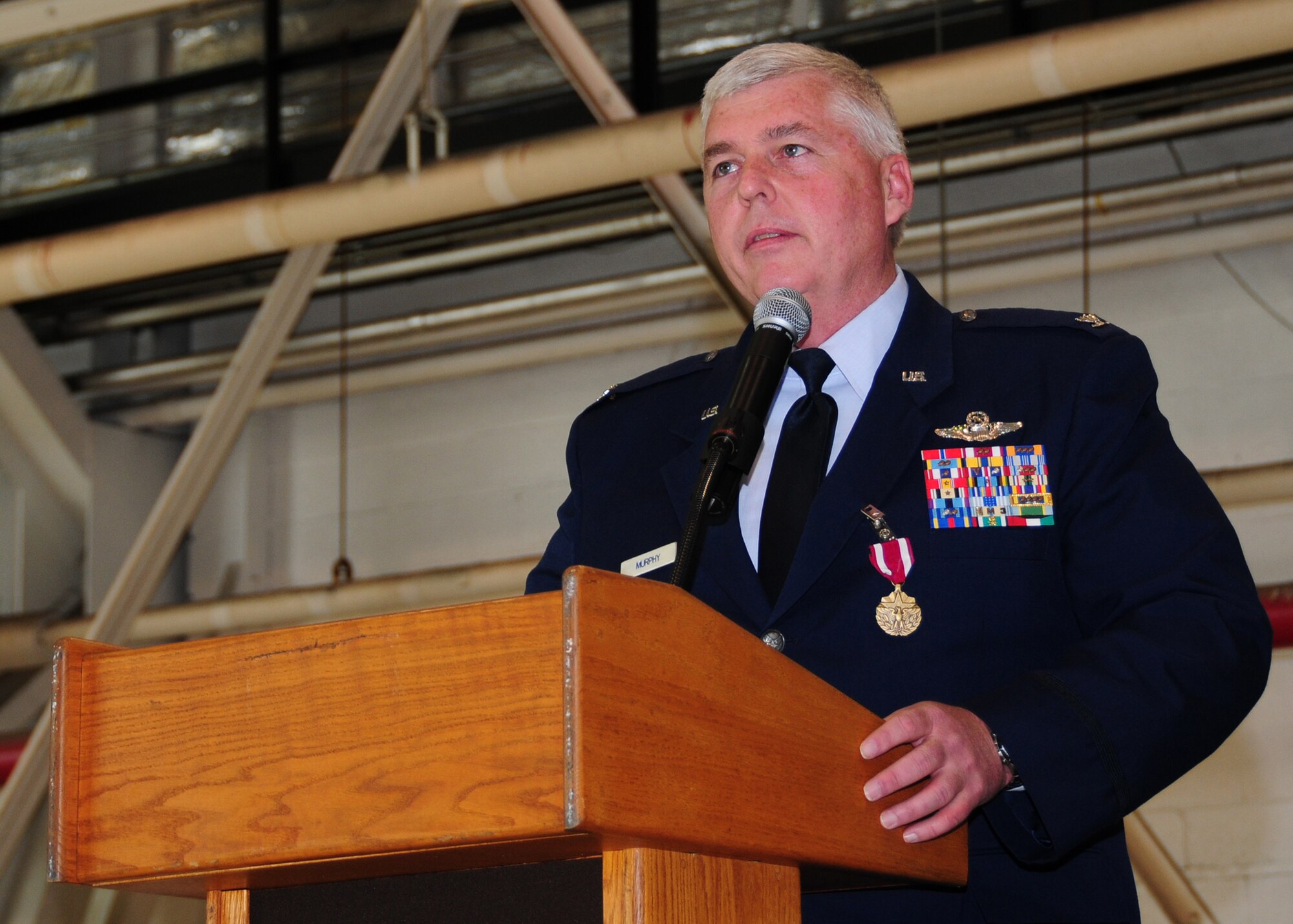 914th Airlift Wing Vice Commander Col. Mark P. Murphy addresses the wing, June 4, 2011, Niagara Falls Air Reserve Station, NY. During his speech, Colonel Murphy thanked his family, friends and the Airmen of the 914th Airlift Wing for their support. (U.S. Air Force photo by Senior Airman Jessica Snow)