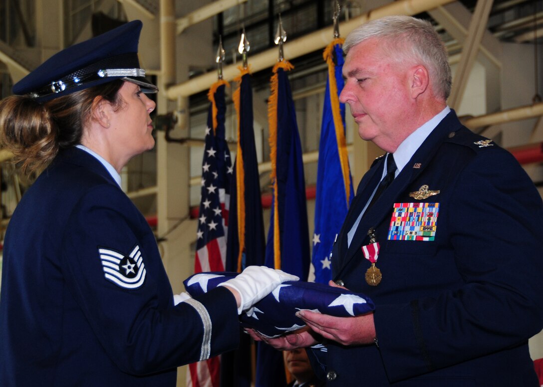 914th Airlift Wing Vice Commander Col. Mark P. Murphy is presented with an American flag, June 4, 2011, Niagara Falls Air Reserve Station, NY. The flag was presented to Colonel Murphy during his retirement ceremony. (U.S. Air Force photo by Senior Airman Jessica Snow)