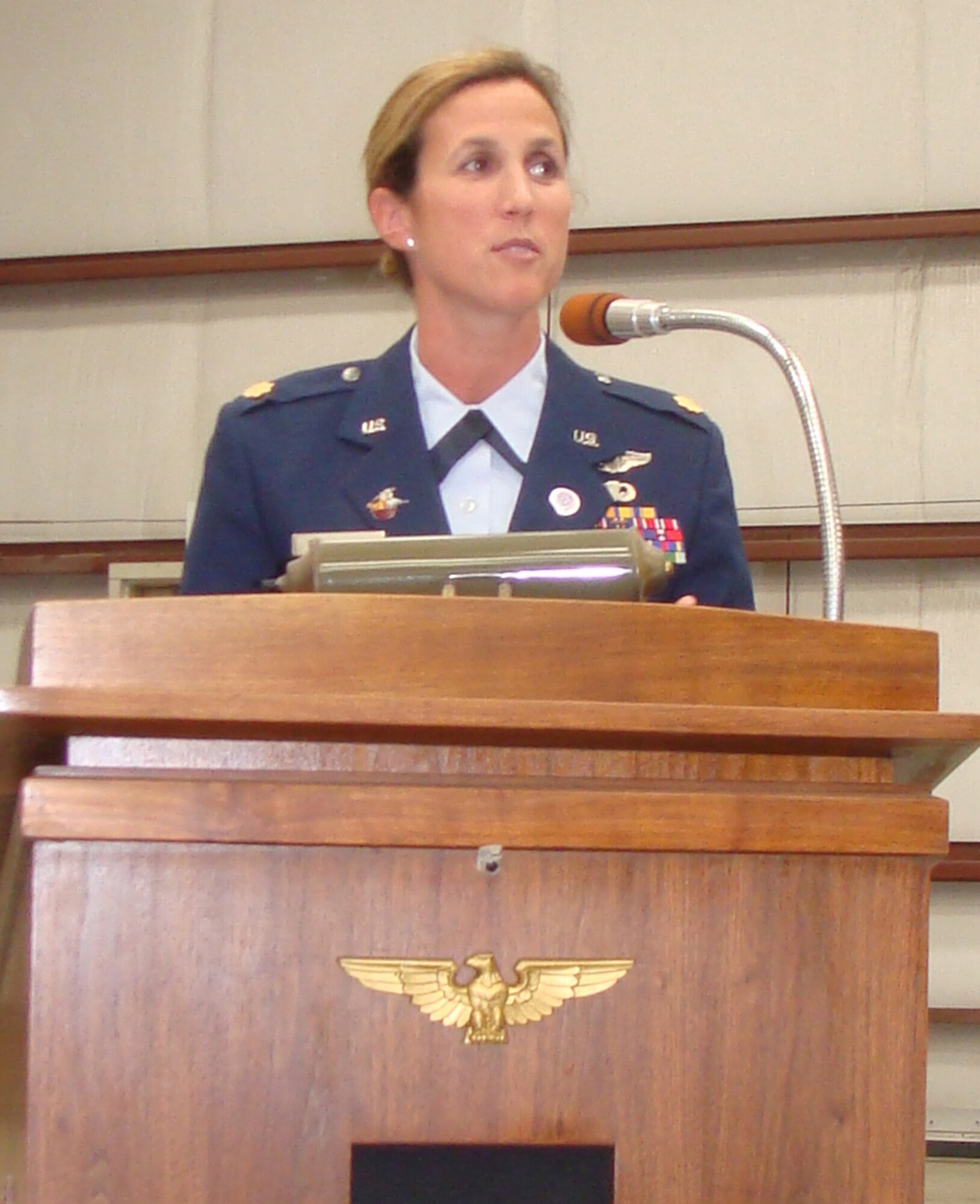 Maj. Lori Rasmussen, an RC-135 pilot assigned to 1st Air Force, speaks during the memorial service for Violet Cowden, a pilot with the Women Airforce Service Pilots – or WASPs, at the Yanks Air Museum in Chino, Calif. The women became friends nearly two years ago when Major Rasmussen was assigned to a team devoted to honoring heroes who demonstrated excellence in air power. (Courtesy photo)