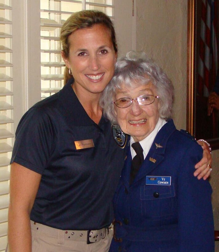 Maj. Lori Rasmussen, an RC-135 pilot assigned to 1st Air Force, stands with Violet Cowden, a pilot with the Women Airforce Service Pilots – or WASPs, before an event at Maxwell Air Force Base, Ala. The women became friends nearly two years ago when Major Rasmussen was assigned to a team devoted to honoring heroes who demonstrated excellence in air power. The major spoke at Ms. Cowden’s memorial service in Chino, Calif., May 21. (Courtesy photo)