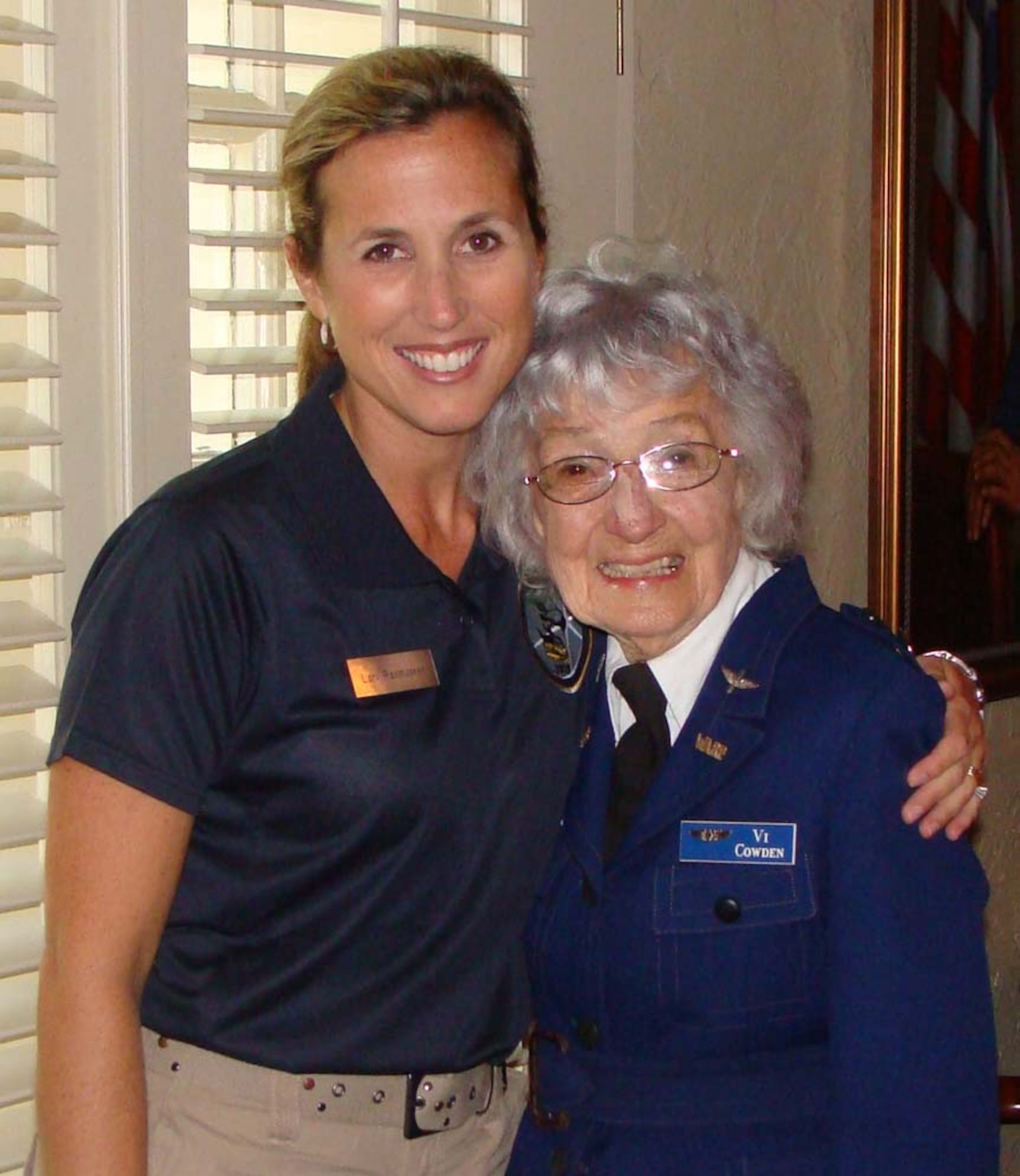Maj. Lori Rasmussen, an RC-135 pilot assigned to 1st Air Force, stands with Violet Cowden, a pilot with the Women Airforce Service Pilots – or WASPs, before an event at Maxwell Air Force Base, Ala. The women became friends nearly two years ago when Major Rasmussen was assigned to a team devoted to honoring heroes who demonstrated excellence in air power. The major spoke at Ms. Cowden’s memorial service in Chino, Calif., May 21. (Courtesy photo)