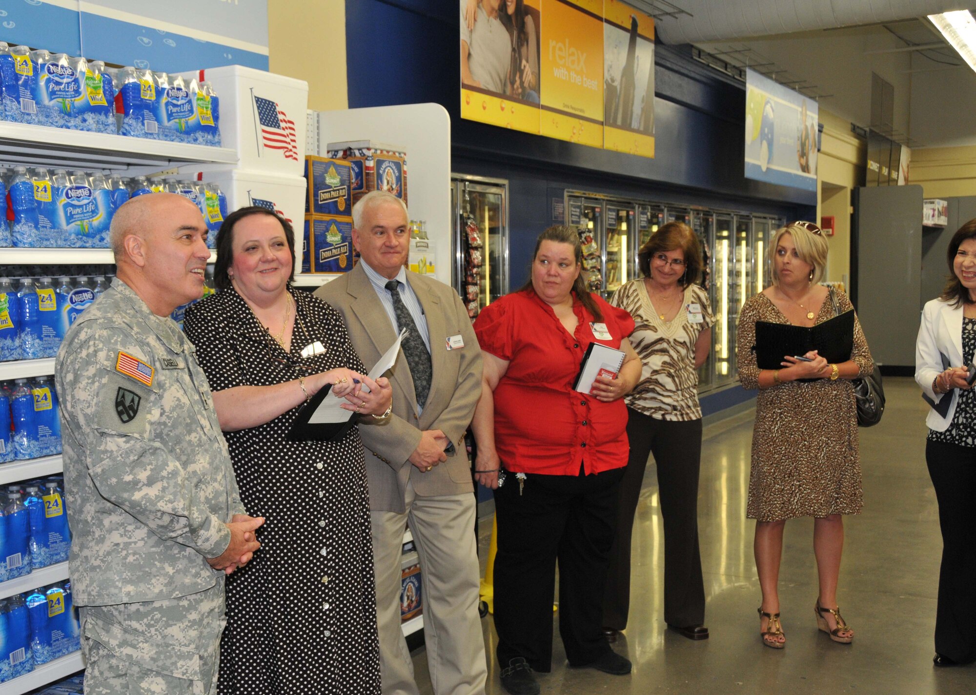 Maj. Gen.Bruce Casella, Comaanding General and CEO of the Army and Air Force Exchange talks with Laura Williams, Twin Cities store Manager; Steve Ard, General manager, McCoy/Twin Cities; Fay Blanton, Dept mgr; Mary Lou Harris, Dept Mgr; Reggie Dawson, VP consumables, HQ Dallas; Trini Saucedo, VP central region
during a visit to the Exchange June 6. (Air Force Photo/Paul Zadach)
