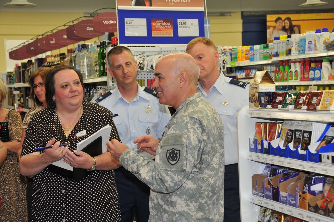 Maj. Gen.Bruce Casella, Comaanding General and CEO of the Army and Air Force Exchange talks with Laura Williams, Twin Cities store manager, Col. Brett Newman (left) 934th Maintnenace Group commander, and Col. Ron Wilt, 934th Operations Group commander during a visit to the Exchange June 6. (Air Force Photo/Paul Zadach)
