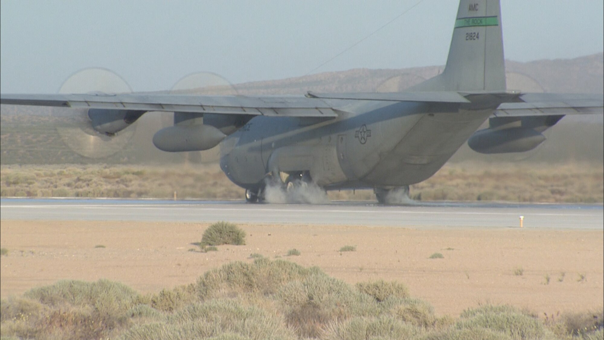 A C-130E from the 19th Airlift Wing at Little Rock Air Force Base, Ark., comes to a screeching halt during a Wheel Brake System Improvement test May 4. The C-130 Hercules is on loan to the 418th Flight Test Squadron to test out new carbon brakes and the Mark IV Digital Antiskid Control Unit. (Air Force image by Doug Spinks)