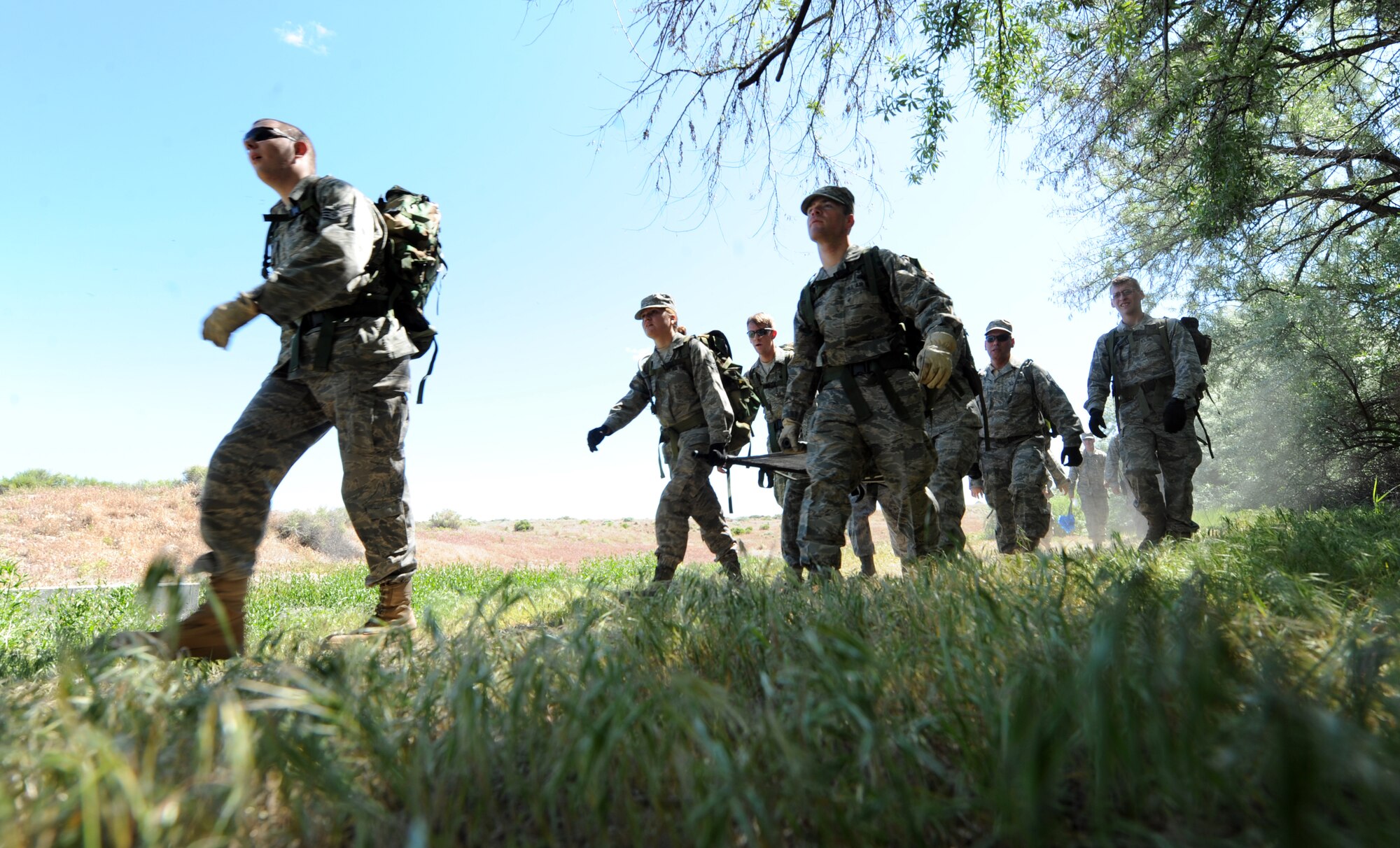 BRUNEAU STATE PARK, Idaho – A team of Airmen from the 726th Air Control Squadron work together to carry a 200-pound dummy through a 1.5-mile course at Bruneau State Park June 3. The team-building exercise helps the 726th ACS maintain their combat ready status to provide air battle management to joint air, land and sea power at a moment’s notice. (U.S. Air Force photo by Senior Airman Debbie Lockhart)