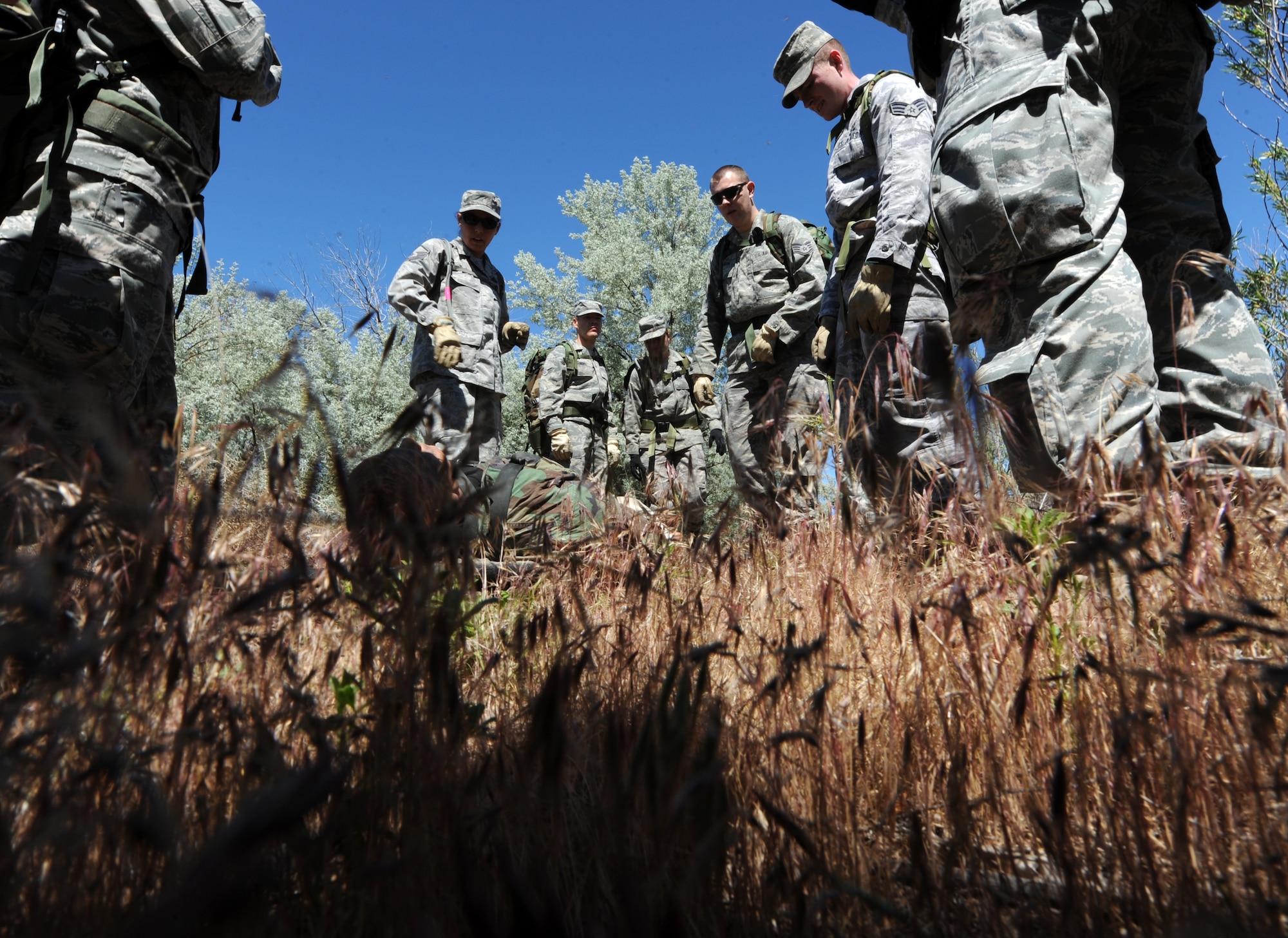 BRUNEAU STATE PARK, Idaho – A team of Airmen from the 726th Air Control Squadron rest after carrying a 200-pound dummy over a sand dune while completing a 1.5-mile course during a training exercise at Bruneau State Park June 3. This team-building exercise helps the 726th ACS maintain their combat ready status to provide air battle management to joint air, land and sea power at a moment’s notice. The squadron tackles a wide-spread mission including enemy surveillance and identification, weapons control, joint and combined data-link connectivity and battle management of offensive and defensive air activities. (U.S. Air Force photo by Senior Airman Debbie Lockhart)