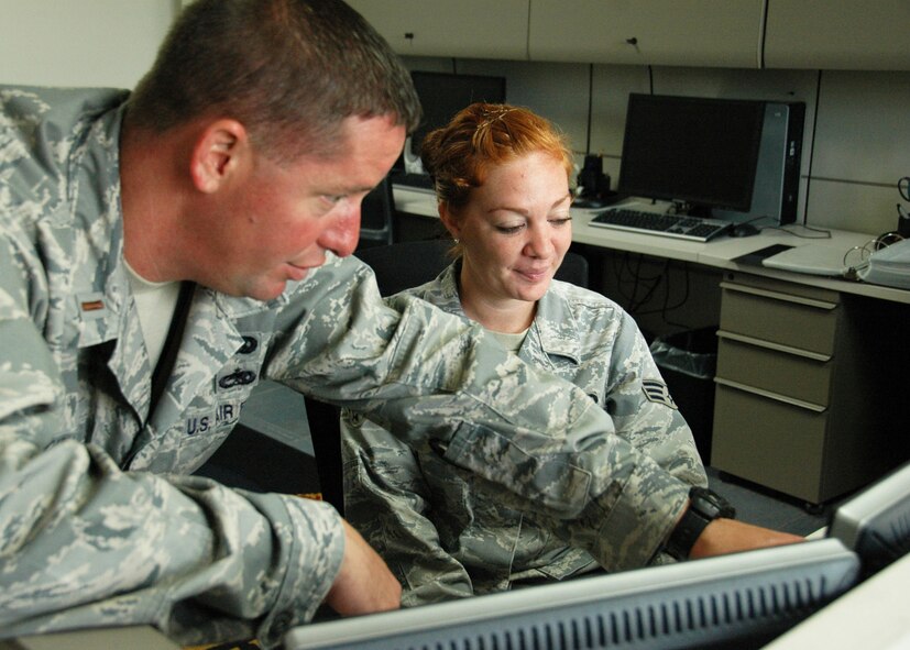 Air Force reservists Second Lt. Gentry Nickell, 919th Logistics Readiness Squadron Fuels Flight commander, and Senior Airman Melissa Spell, vehicle maintenance journeyman, review vehicle management analysis data at the Vehicle Management Flight customer service counter.   The flights are just two of several comprising the the LRS, winner of the Air Force's 2010 Air Reserve Component Base Logistics Activity award. (U.S. Air Force photo/Dan Neely)