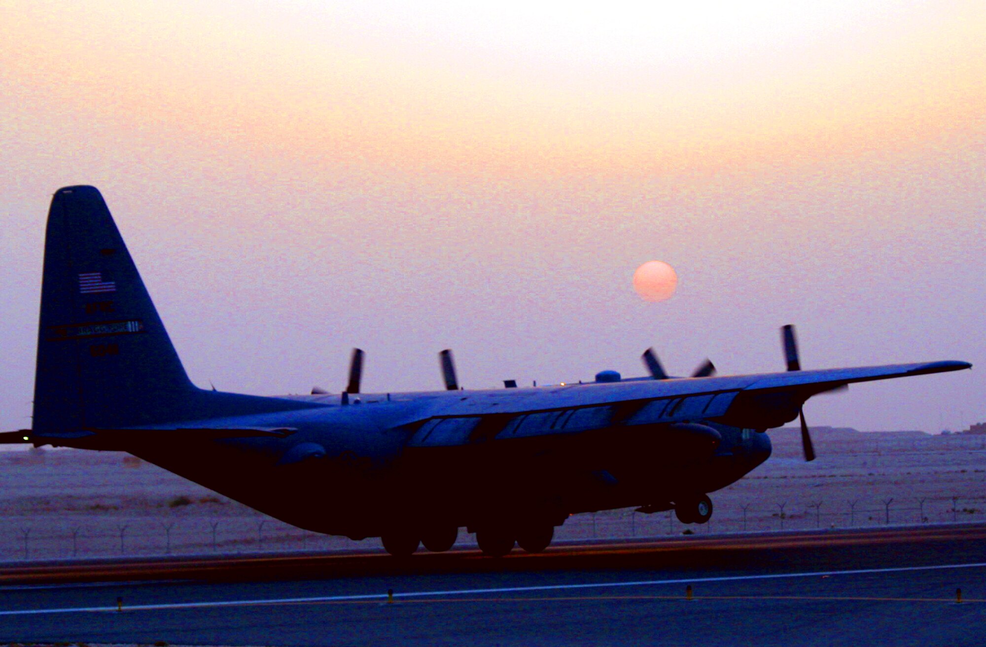 A C-130 Hercules assigned to the 379th Air Expeditionary Wing at a non-disclosed location in Southwest Asia returns from a combat airlift mission on June 7, 2011. The 379th AEW supports operations New Dawn and Enduring Freedom and the Combined Joint Task Force-Horn of Africa. (U.S. Air Force Photo/Master Sgt. Scott T. Sturkol)
