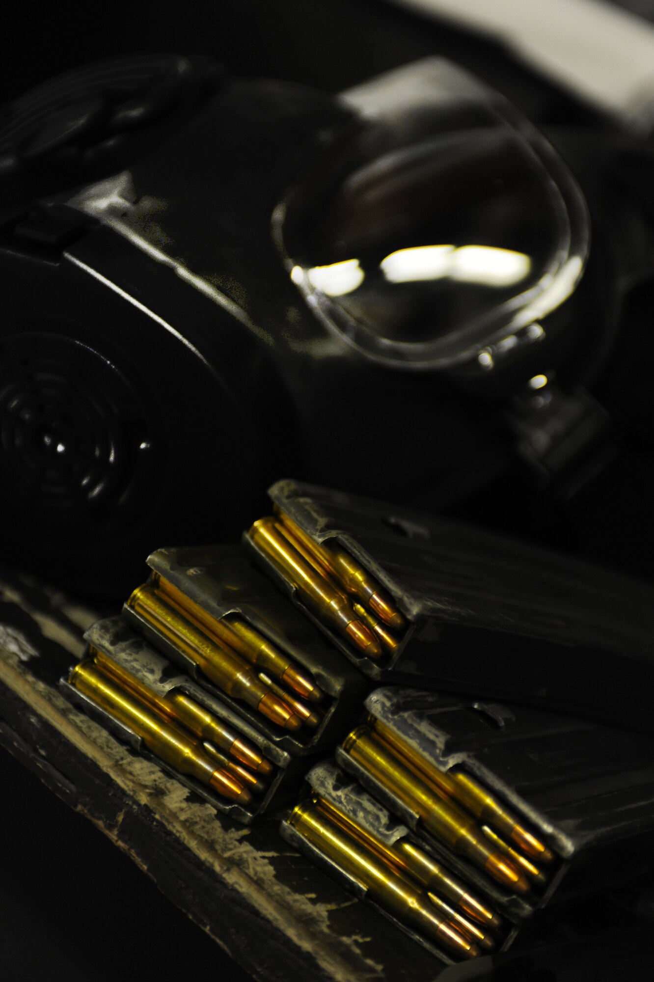 MINOT AIR FORCE BASE, N.D. -- Equipment for qualification on firing sits on a ledge ready for use at the Combat Arms Training and Maintenance firing range here June 7. Airmen tasked to deploy train to ensure proficiency with combat firearms. (U.S. Air Force Photo/Airman 1st Class Aaron-Forrest Wainwright)