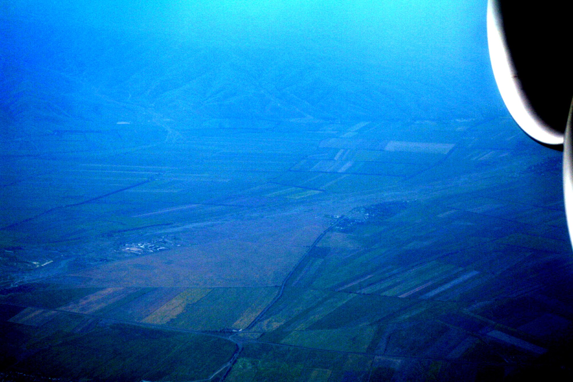 Thne countryside of Kygyzstan can be seen through the window of a C-5M Super Galaxy during an airlift mission on June 7, 2011.  (U.S. Air Force Photo/Master Sgt. Scott T. Sturkol)