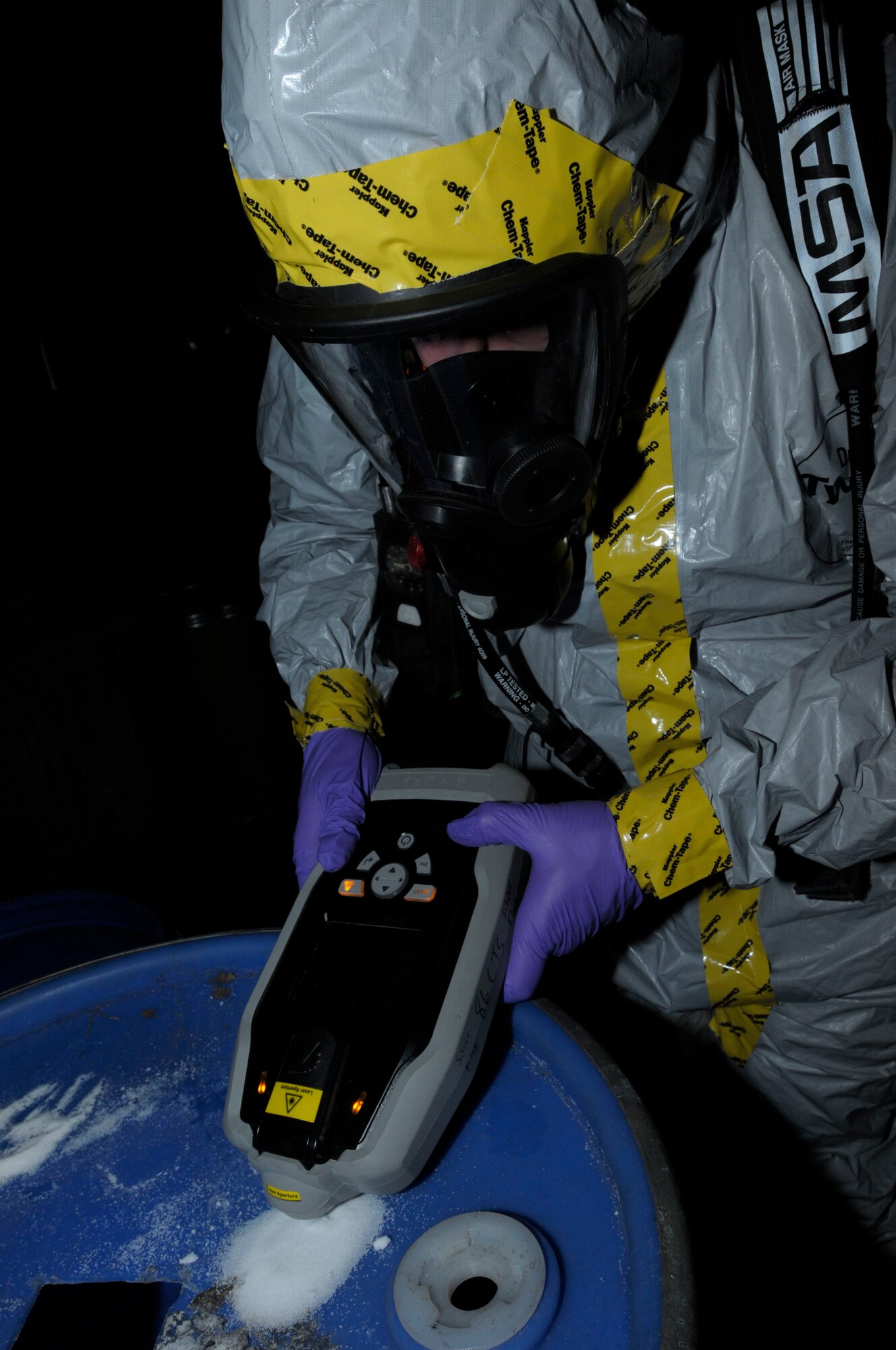 U.S. Air Force Airman 1st Class Jeremy Hickson, 886th Civil Engineer Squadron emergency management, analyzes a simulated unknown substance during a Silver Flag exercise, Ramstein Air Base, Germany, June 7, 2011. Silver Flag is a weeklong training program for Airmen from various bases; it combines classroom and practical application exercises to prepare Airmen for deployment. (U.S. Air Force photo by Airman 1st Class Desiree Esposito)
