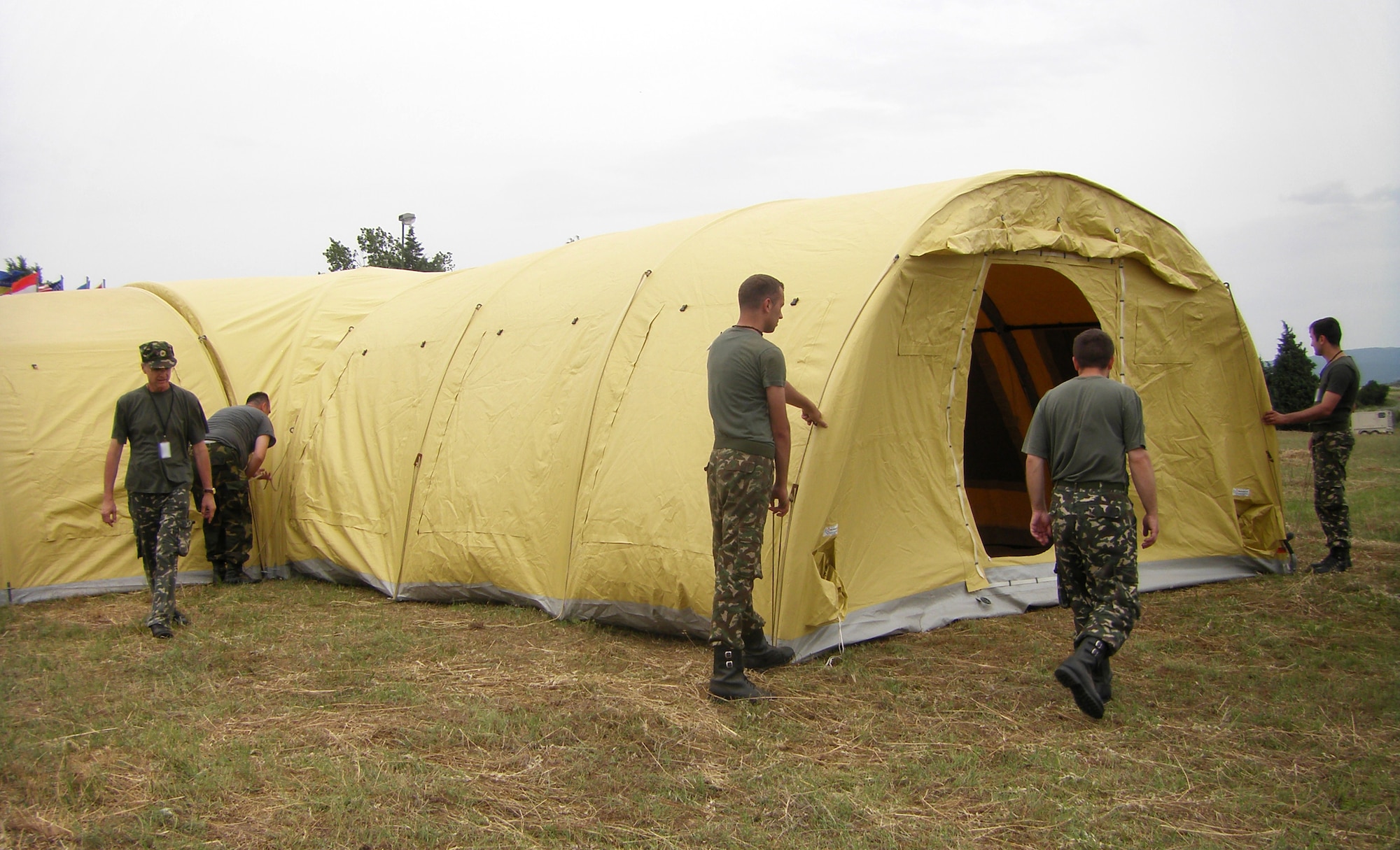 CAMP PEPELISHTE, Macedonia – Members of the Serbian army position a wing of their surgical field hospital, or Role Two, in preparation for Medical Training Exercise in Central and Eastern Europe 2011. The countries participating in this year’s MEDCEUR are Macedonia, Montenegro, Bosnia and Herzegovina, Serbia, Slovenia, Norway and the United States. MEDCEUR is a Partnership for Peace and Chairman of the Joint Chiefs of Staff-sponsored regional and multilateral exercise in Central and Eastern Europe designed to provide medical training and operational experience in a deployed environment.  (U.S. Air Force photo/Master Sgt. Kelley J. Stewart)