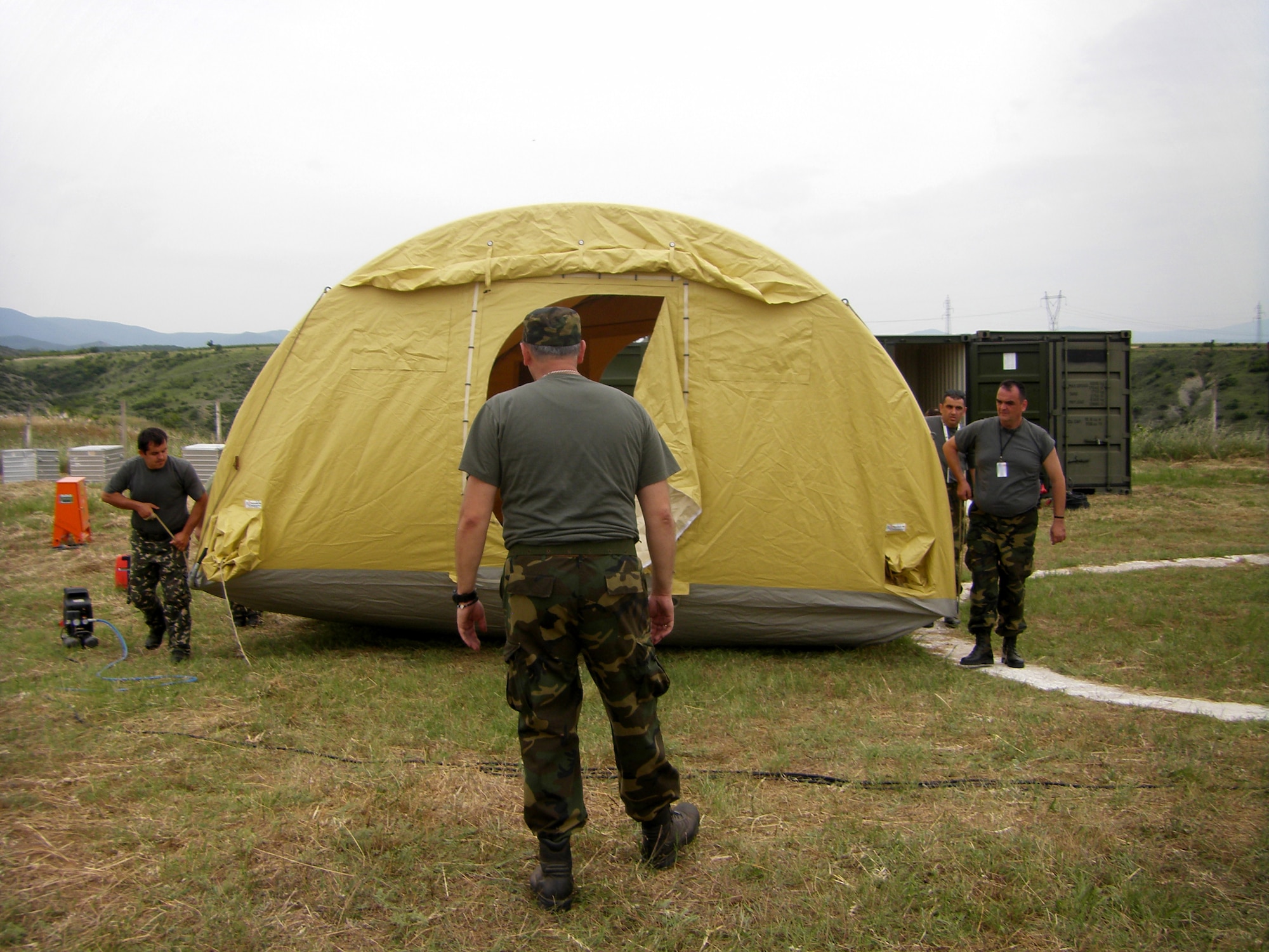 CAMP PEPELISHTE, Macedonia – Members of the Serbian army prepare to lift and position a wing of their surgical field hospital, or Role Two, in preparation for Medical Training Exercise in Central and Eastern Europe 2011. The countries participating in this year’s MEDCEUR are Macedonia, Montenegro, Bosnia and Herzegovina, Serbia, Slovenia, Norway and the United States. MEDCEUR is a Partnership for Peace and Chairman of the Joint Chiefs of Staff-sponsored regional and multilateral exercise in Central and Eastern Europe designed to provide medical training and operational experience in a deployed environment.  (U.S. Air Force photo/Master Sgt. Kelley J. Stewart)