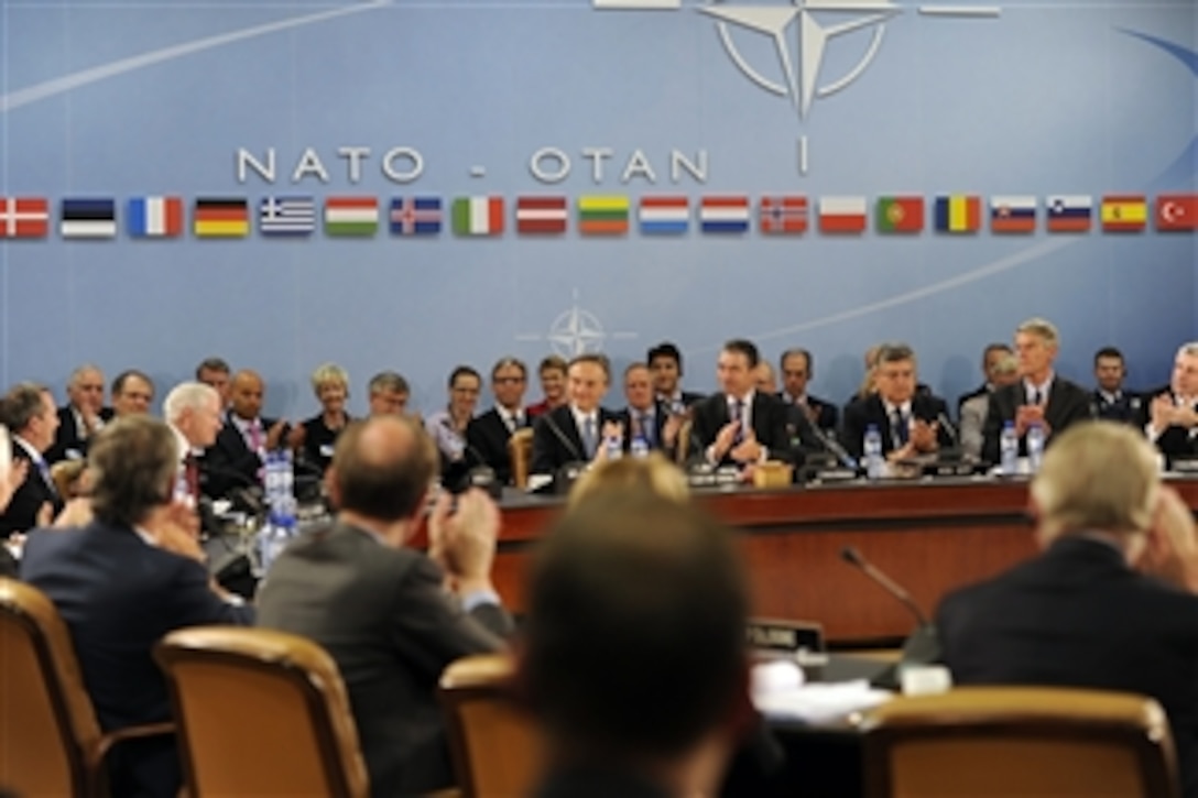 Participants at the North Atlantic Council meeting applaud Secretary of Defense Robert M. Gates after thanking him for his service to NATO during the NATO Defense Ministerial in Brussels, Belgium, on June 8, 2011.  
