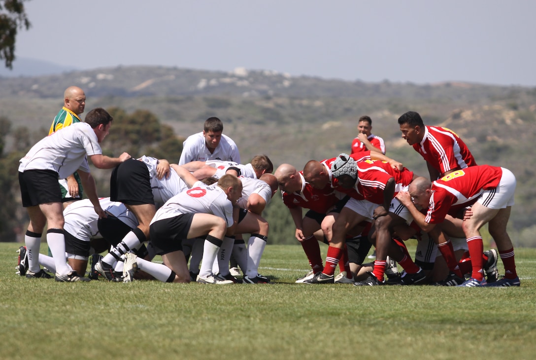 Marines and sailors from the Camp Pendleton Ghostriders Rugby Football Club square down against the 7th Parachute Royal Horse Artillery Rugby Team in a "scrum" at the 11-area football field, June 8. The British Army soliders took a post-Afghanistan-tour along the California coast to strengthen the bond between the two nations.