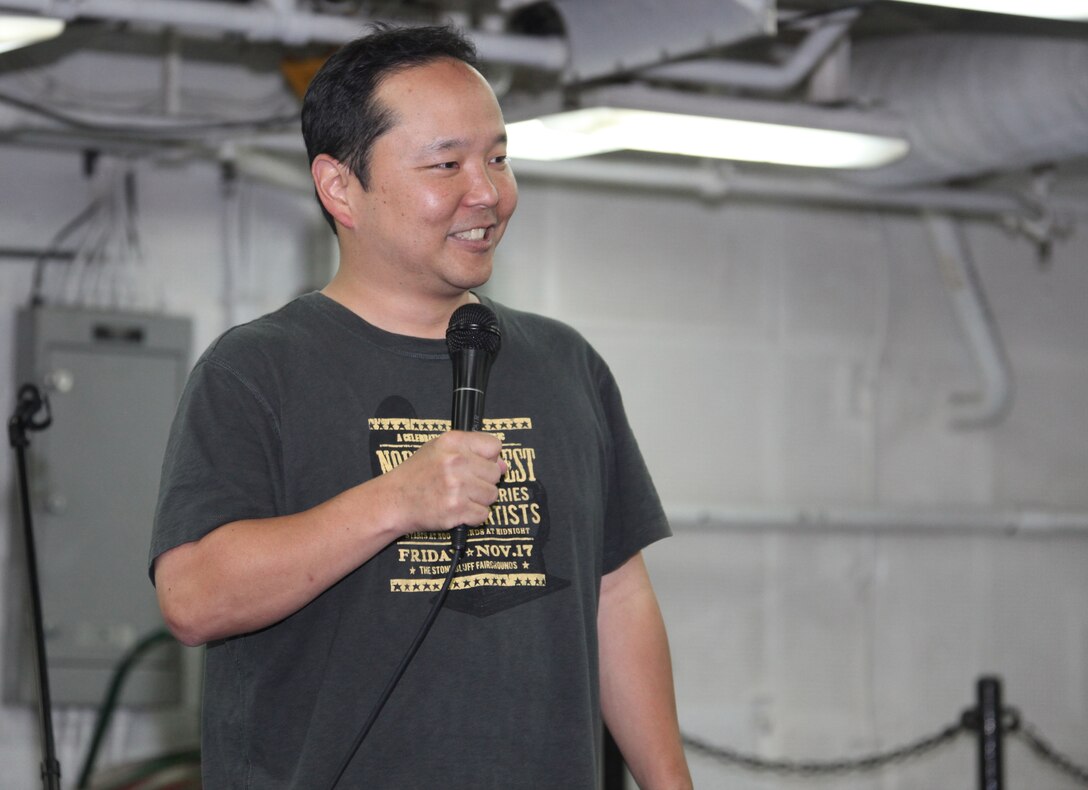Paul Ogata, a comedian with the “Comics on Duty” world tour, performs a show for Marines and sailors aboard USS Bataan June 8, 2011. Comedians Paul Ogata and J.R. Brow performed two shows for the Marines and sailors deployed aboard USS Bataan in the Mediterranean Sea. The Marines and sailors of the 22nd MEU are currently deployed with Amphibious Squadron 6 aboard the USS Bataan Amphibious Ready Group and will continue to train and improve the MEU’s ability to operate as a cohesive and effective Marine Air Ground Task Force. The 22nd MEU is a multi-mission, capable force comprised of an Aviation Combat Element, Marine Medium Tilt Rotor Squadron 263 (Reinforced); a Logistics Combat Element, Combat Logistics Battalion 22; a Ground Combat Element, Battalion Landing Team, 2nd Battalion, 2nd Marine Regiment; and its Command Element.