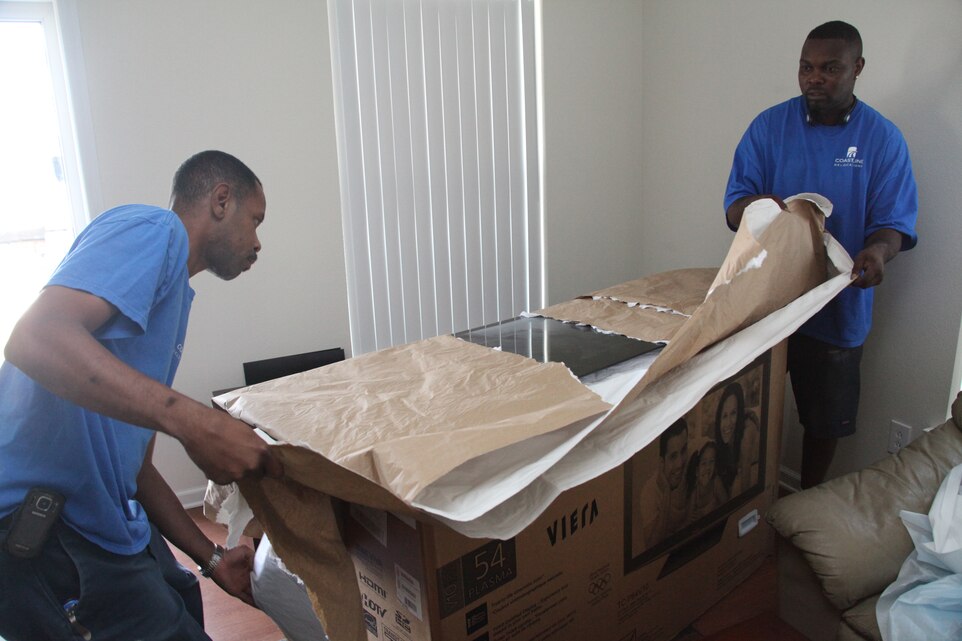 Government contracted movement specialists pack furniture aboard Marine Corps Air Station Cherry Point June 6. The summer months are the peak of business for moving companies, causing backups in business and long wait periods. Marines and Sailors receiving new orders can find themselves without help preparing their possessions and family without proper planning.
