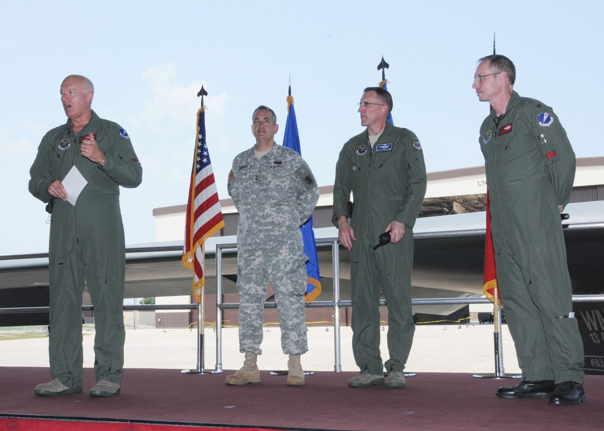 Lt. Gen. Harry M “Bud” Wyatt III, Air National Guard Director, addresses 131st Bomb Wing Missouri Air National Guard personnel at a Wing all call, June 4, to celebrate the unveiling of the 131st wing patch onto the B-2 “Spirit of Missouri. “   Left to right:  Wyatt, Maj. Gen. Stephen Danner, Adjutant General for the Missouri National Guard, Brig Gen. Scott Vander Hamm, 509th Bomb Wing commander, Col. Greg Champagne, 131st Bomb Wing commander.  (U.S. Air Force photo by Master Sgt. Mary-Dale Amison)