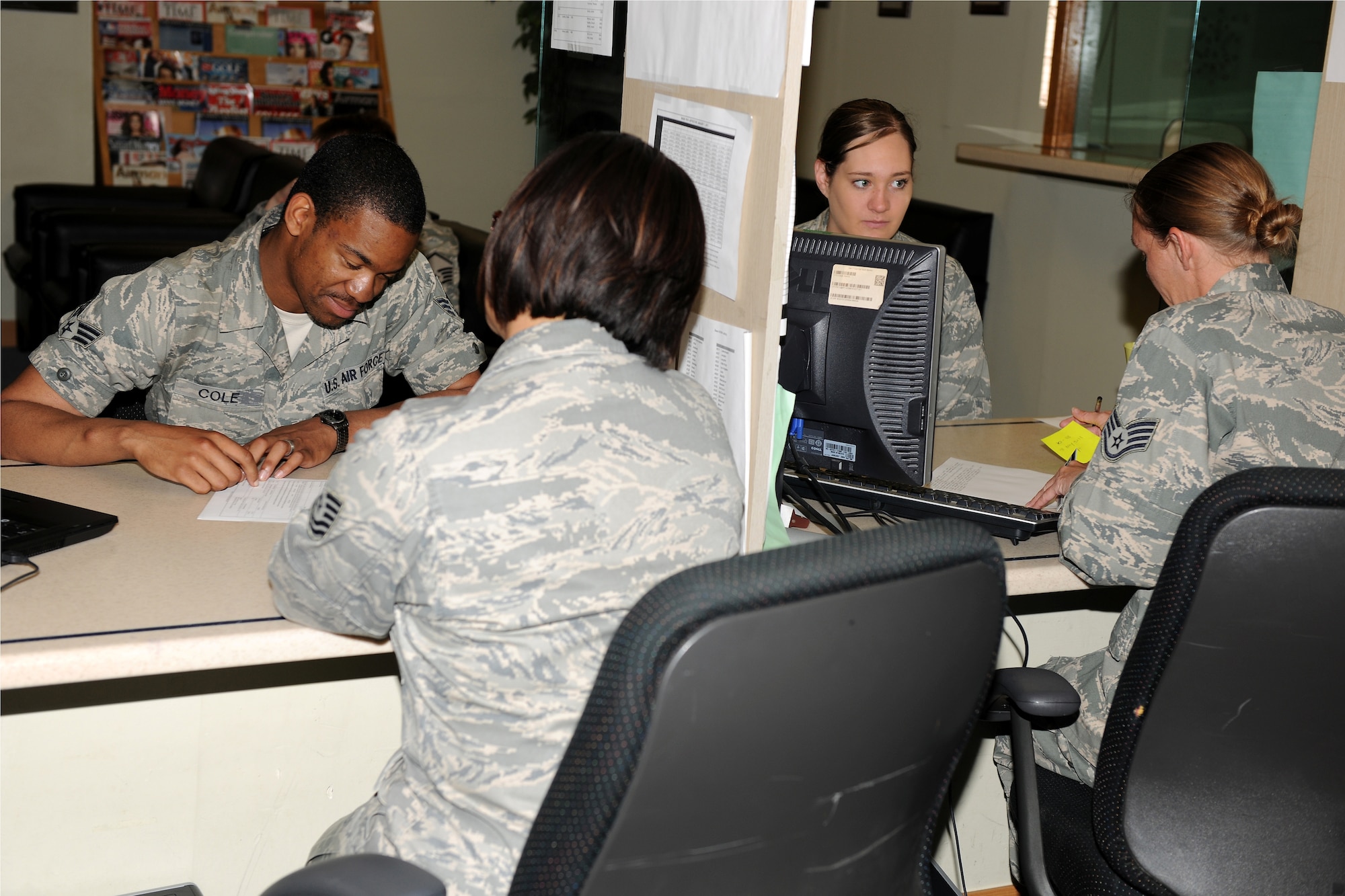 KUNSAN AIR BASE, Republic of Korea -- Tech. Sgt. Warrell Shanklin , 8th Comptroller Squadron customer support NCO-in-charge, and Staff Sgt. Jeannie Hartman, 8th CPTS customer support supervisor, assists customers with finances here June 8. The 8th CPTS provides assistance with travel vouchers, pay information and other fianancial services and needs. (U.S. Air Force photo/Senior Airman Ciara Wymbs)