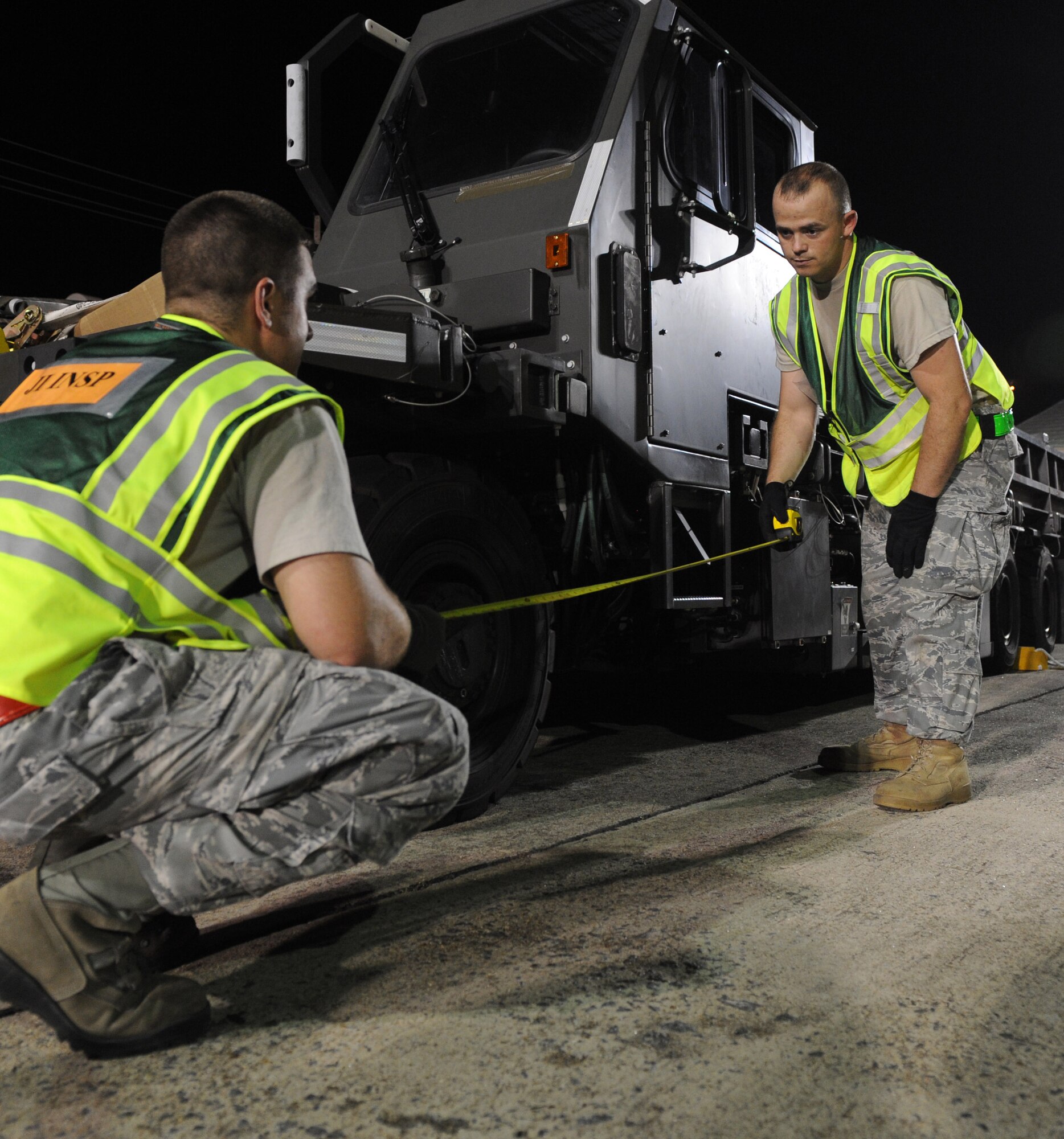 Staff Sgt. Jonathan Ruelle, a joint inspection supervisor with the 19th Logistics Readiness Squadron, and Staff Sgt. Matthew Gregg, an air transportation journeyman with the 19th LRS, measure to find the center of balance for a 25k Loader on June 4, 2011 at Little Rock Air Force Base, Ark.  Sergeants Ruelle and Gregg supported an operational readiness exercise by determining cargo placement within C-130 aircraft. (U.S. Air Force photo by Tech. Sgt. Chad Chisholm)