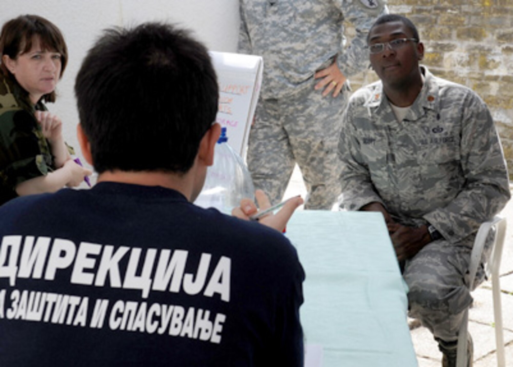 Maj. Alvin Scott teaches students from multinational partners June 8, 2011, in Macedonia, as part of the 2011 Medical Training Exercise in Central and Eastern Europe. MEDCEUR 11 is an annual, regional and multilateral exercise sponsored by the Chairman of the Joint Chiefs of Staff. Major Scott is the U.S. Northern Command liaison officer to the U.S. Transportation Command Surgeon General and a Defense Institute for Medical Operations instructor. (U.S. Air Force photo/Staff Sgt. Nadine Barclay)