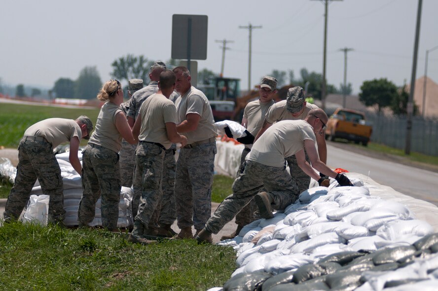 Airmen from the 139th Airlift Wing, Missouri Air National Guard, lay sandbags along Airport Road that leads to Rosecrans Memorial Airport June 7, 2011. The Missouri River is expected to rise over the next few weeks. (U.S. Air Force photo by Senior Airman Sheldon Thompson/Released)
