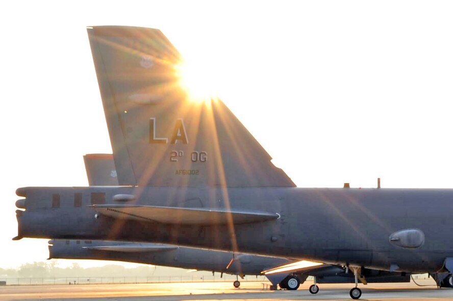 The morning sun shines across the tail of a B-52H Stratofortress parked on the ramp at Barksdale Air Force Base, La., June 9. Work on the base starts early in order to prepare the bombers for their daily flying missions. (U.S. Air Force photo/2nd Lt Tori Lalich)
