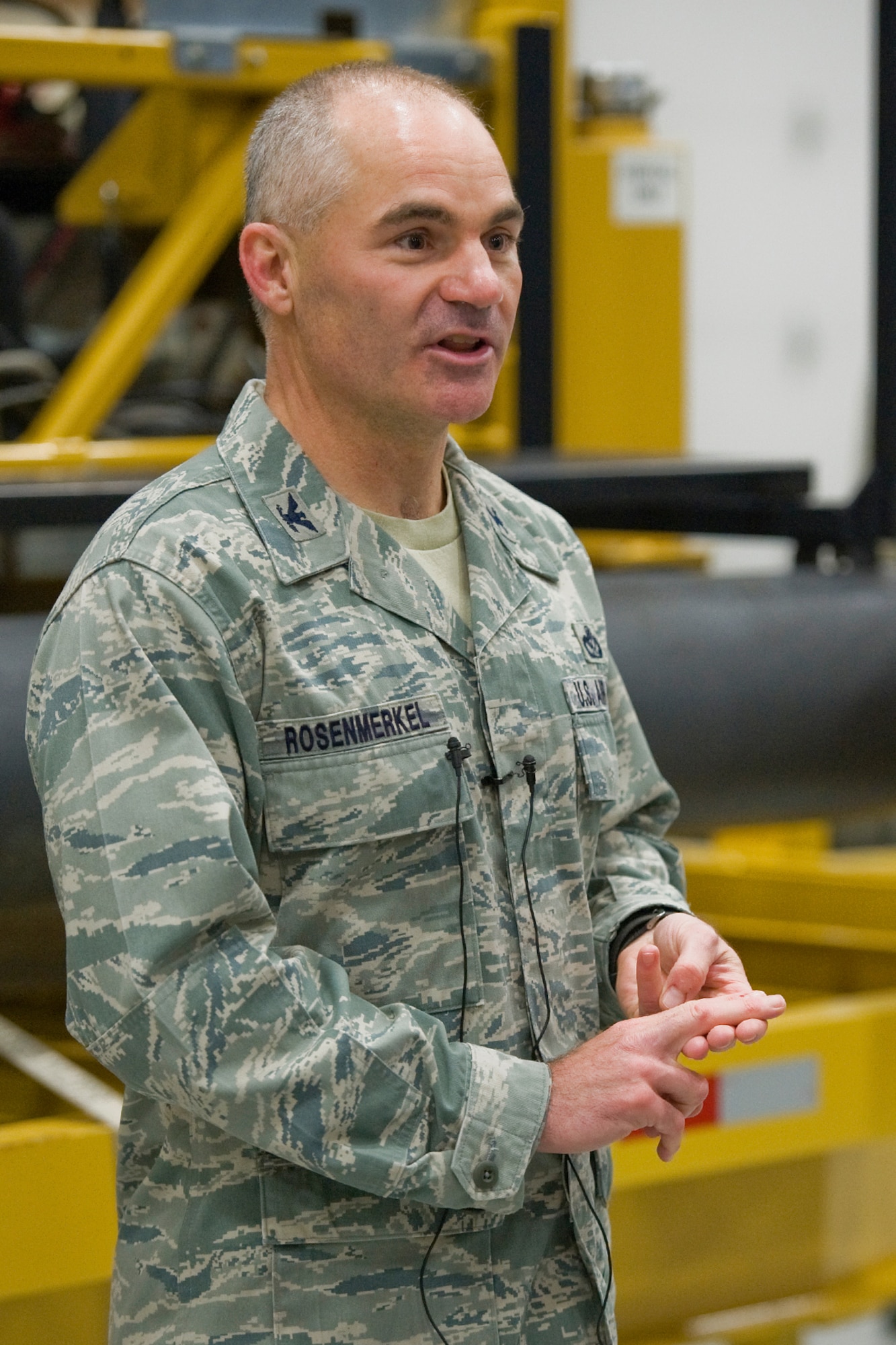 Col. Gregory Rosenmerkel, 819th RHS commander, explains to the media the history of the bulldozer as a symbol of their heritage during their open house June 3. (U.S. Air Force photo / Beau Wade)