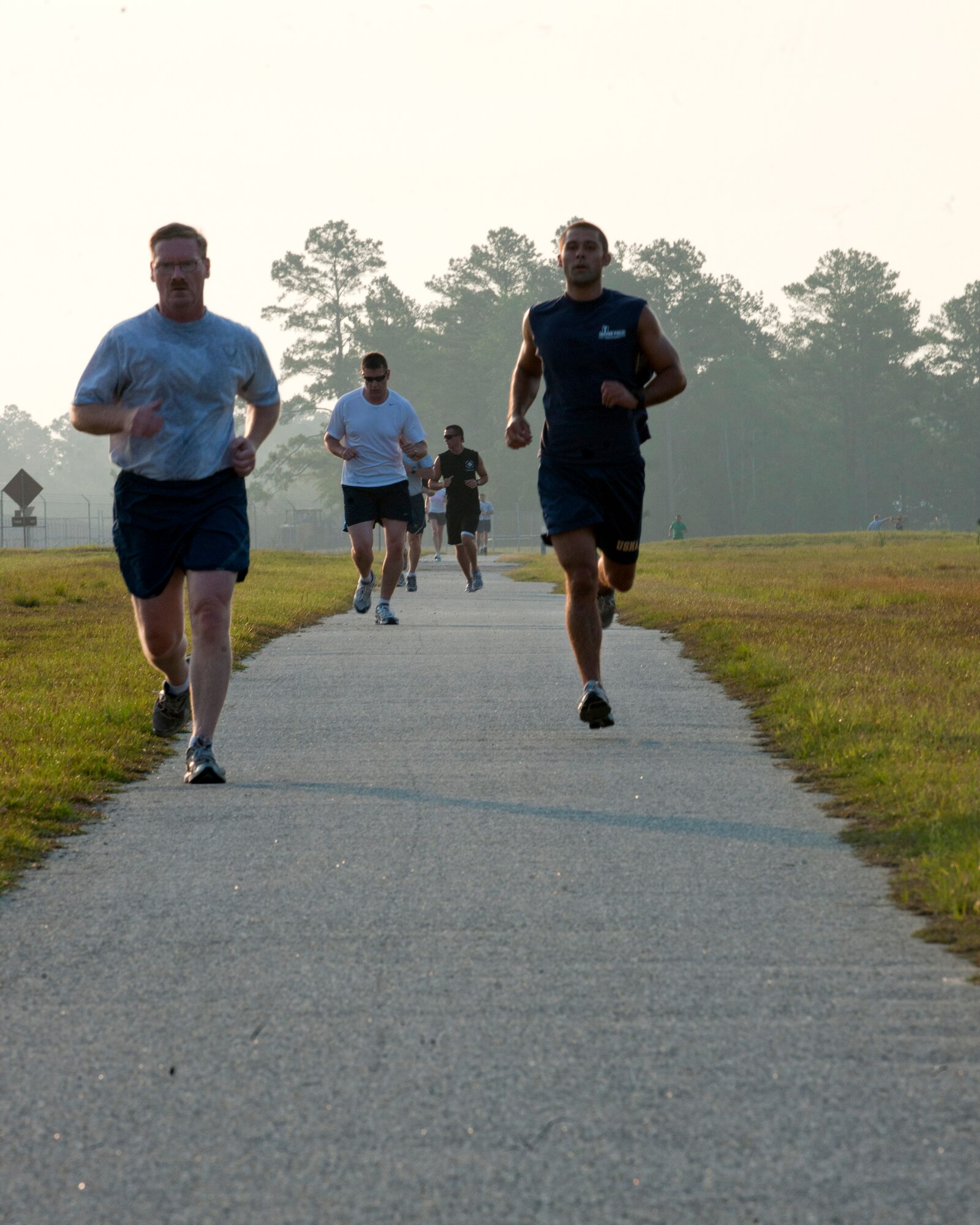 Members from Moody Air Force Base, Ga., sprint past the halfway point of the 6.6 kilometer run June 9. Airmen ran to honor the memory of Pedro 66.  The HH-60G Pave Hawk crashed one year ago in Southeastern Afghanistan killing five Airmen during a medevac mission. (U.S. Air Force photo/Senior Airman Benjamin Wiseman)(RELEASED)