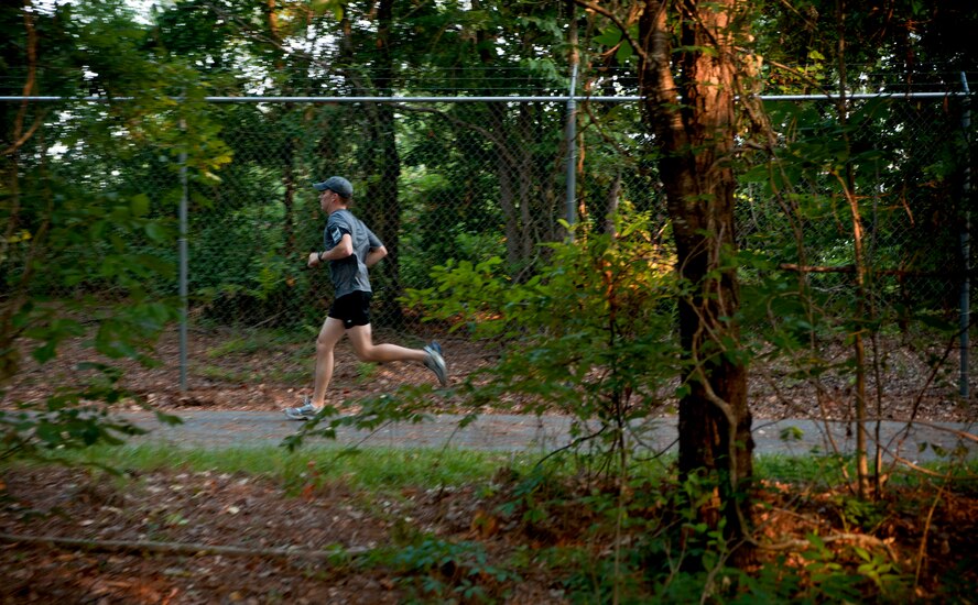 Staff Sgt. Anthony Robinson, 38th Rescue Squadron, runs through the woods during a 6.6 kilometer run at Moody Air Force Base, Ga., June 9. Moody personnel ran to honor the one year anniversary of the Pedro 66 helicopter crash. The mission went down in Southeastern Afghanistan and killed five Airmen from geographically separated units of the 23rd Wing. (U.S. Air Force photo/Senior Airman Benjamin Wiseman)(RELEASED)